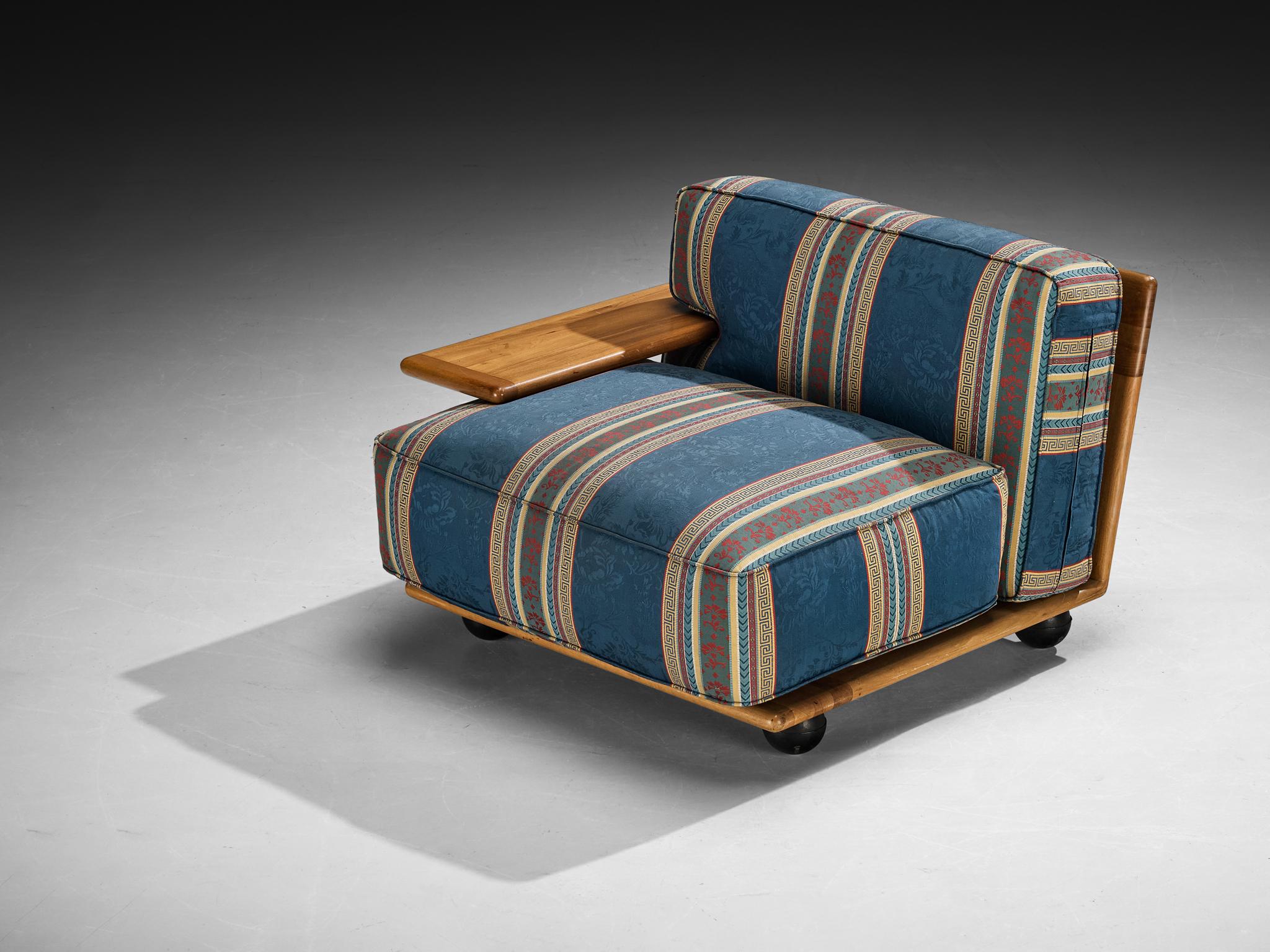 Mario Bellini for Cassina, 'Pianura' lounge chair, walnut, fabric, Italy, 1971

The Pianura series is conceived by Mario Bellini for the Italian furniture company Cassina in 1971. The design adheres to an unconventional construction based on