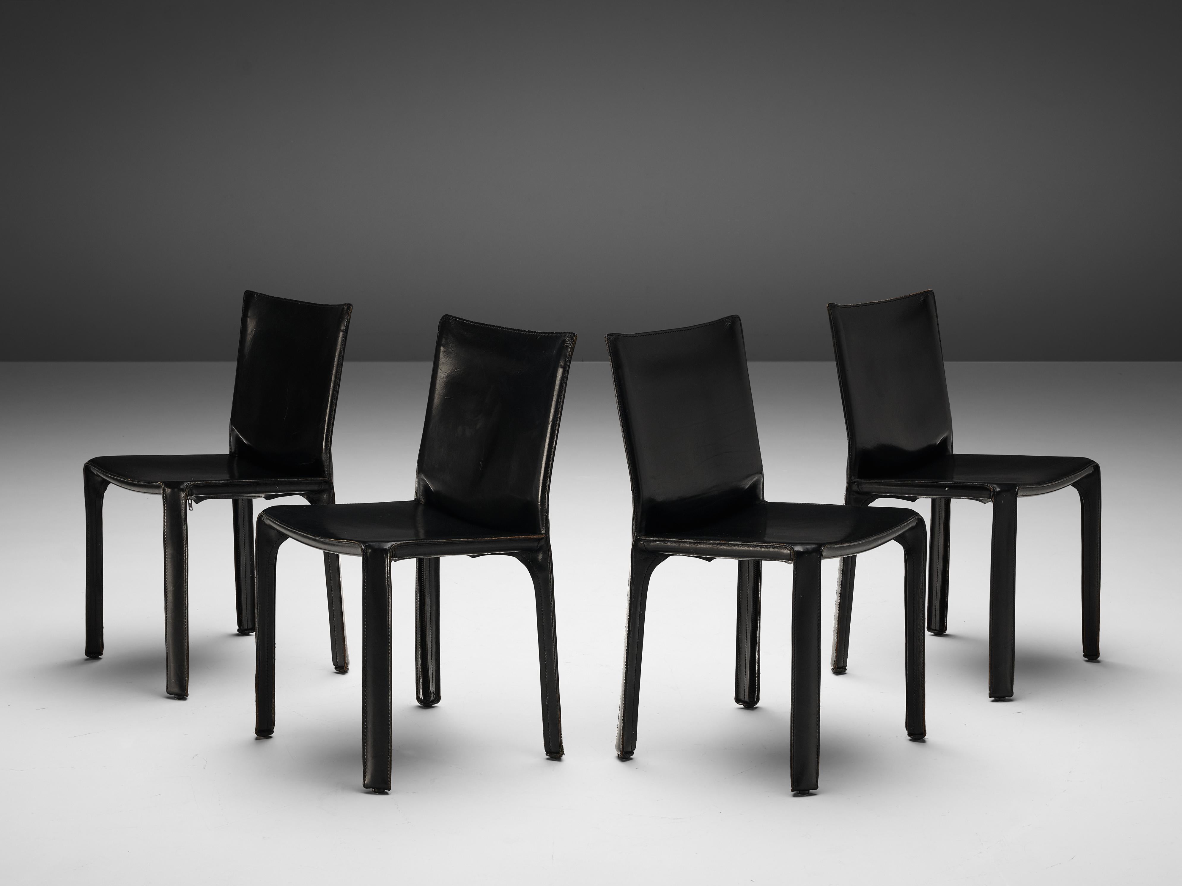 Mario Bellini for Cassina, set of four 'cab' dining chairs model 412, black leather, Italy, 1976

Set of four chairs designed by Mario Bellini for Cassina in 1976. Conceptually, the 'Cab' chair was designed to become marked and shaped over time by