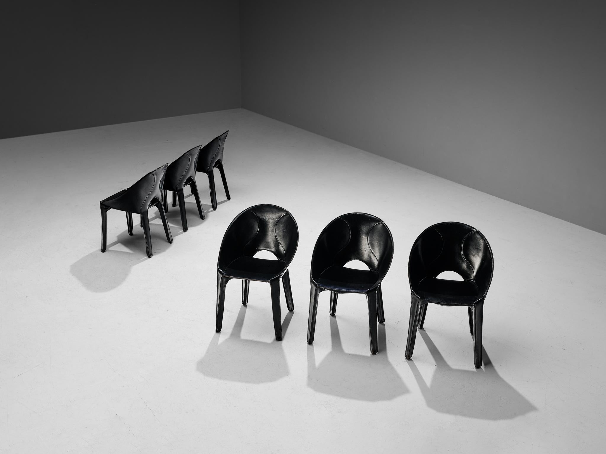 Mario Bellini for Cassina, set of six ‘Lira e Liuto’ dining chairs, black leather, Italy, 1989

This postmodern set of six ‘Lira e Liuto’ dining chairs is executed in black leather that is stitched to the seat. The four legs and the rounded seat are
