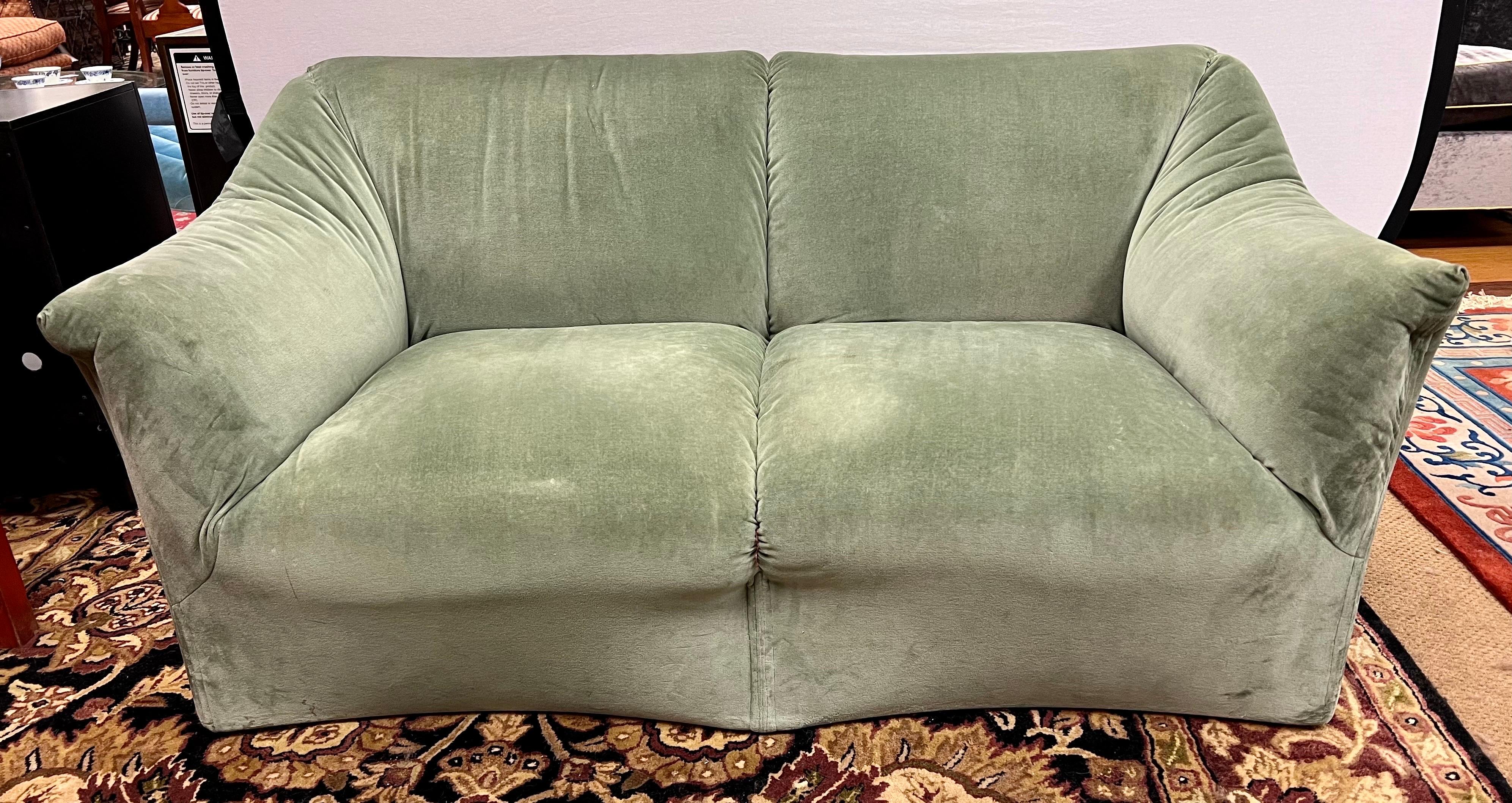 Vintage Tentazione loveseat's sculptural curves offer refined elegance and luxurious comfort. Designed by Mario Bellini and manufactured by Cassina, Italy, circa 1970s. This loveseat sofa looks similar to the earlier designed Bambole sofa by Bellini