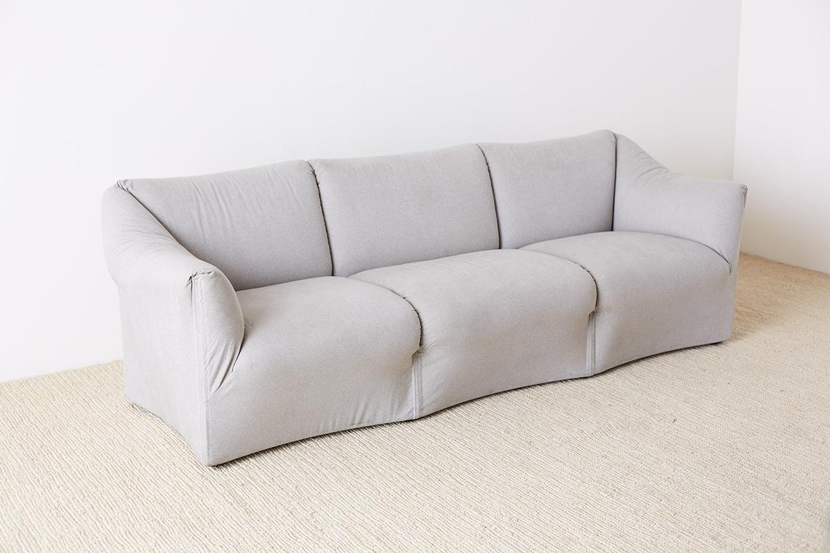 Rare B & B Italia Tentazione upholstered sofa designed by Mario Bellini for Cassina. Features a beautiful grey flannel style upholstered form. The Tentazione design was similar to the iconic La Bambole style but made with a more dramatic serpentine