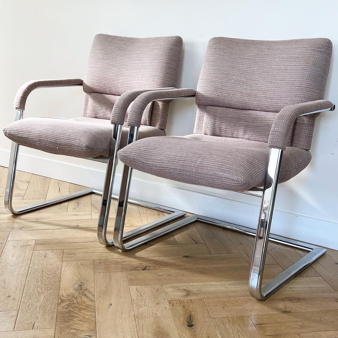 A pair of modernist cantilever lounge, club, or conference chairs by Mario Bellini for Vitra, signed, 1989. Made in Italy. D’après the iconic 1920s Bauhaus prototype. Chrome frames with original bouclé / tweed blend upholstery in tones of peony and