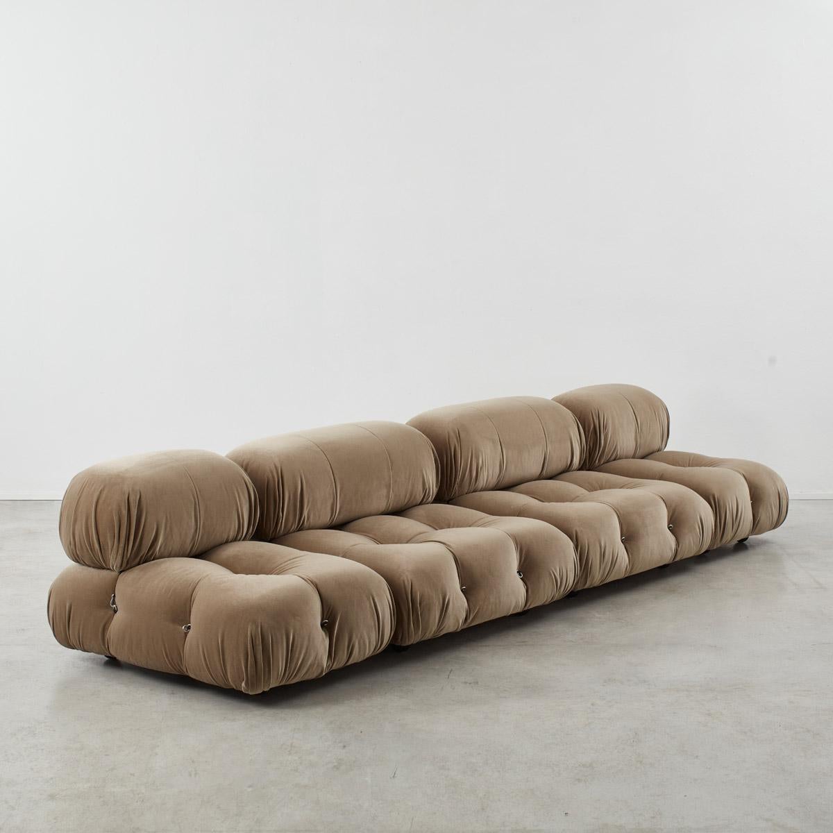 This modular sofa was designed by Mario Bellini in 1971 and was manufactured by B&B Italia. The backs and armrests are provided with rings and carabineers, which allows the user to create the desired configuration best suited to their needs. The