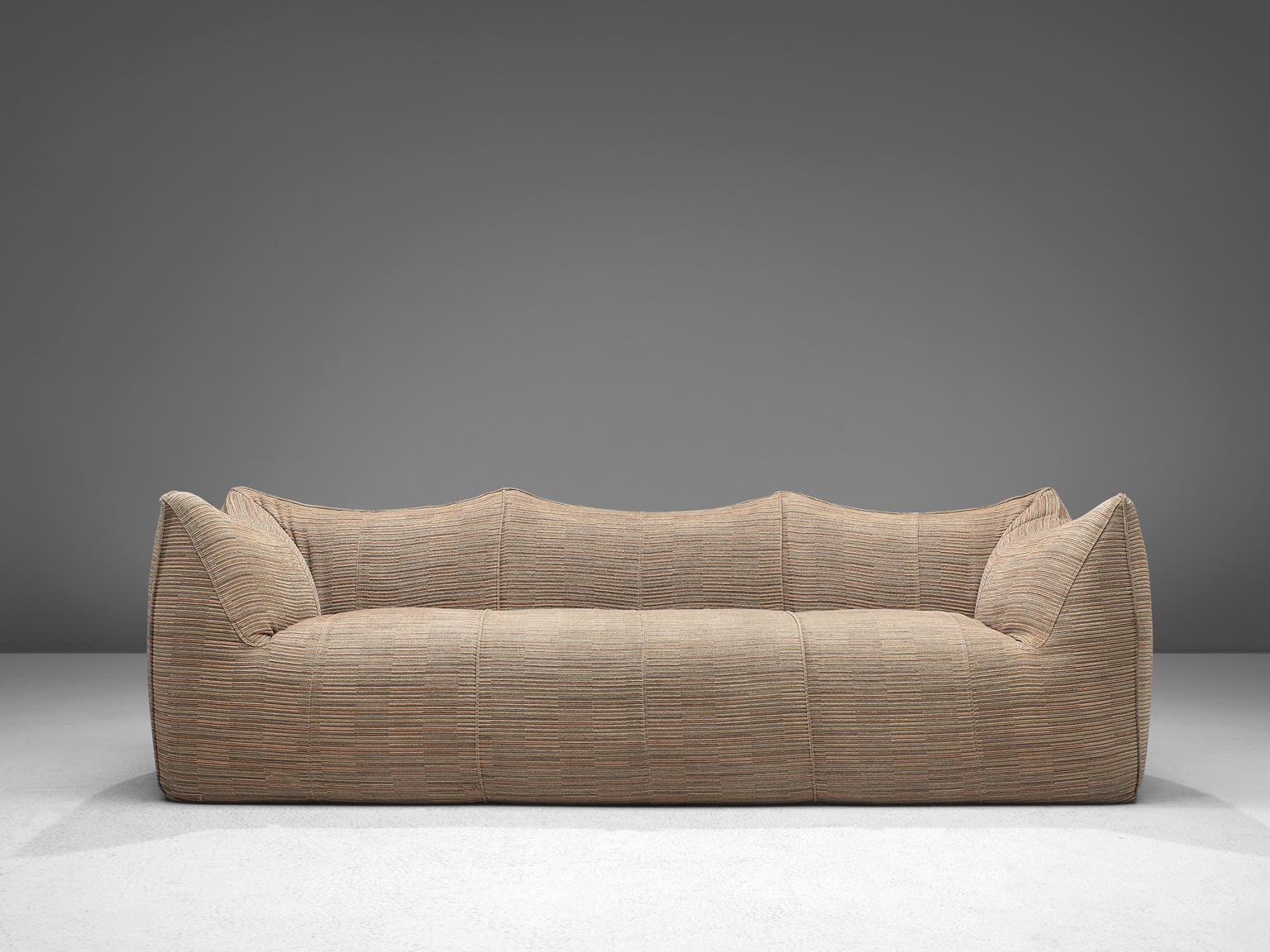 Mario Bellini for B&B Italia, 'Le Bambole' sofa, fabric, Italy, 1972. 

This comfortable beige three seat sofa is bulky and playful, shaped as if it is merely a large cushion and the accompanying feeling is the same. It is designed by Mario Bellini