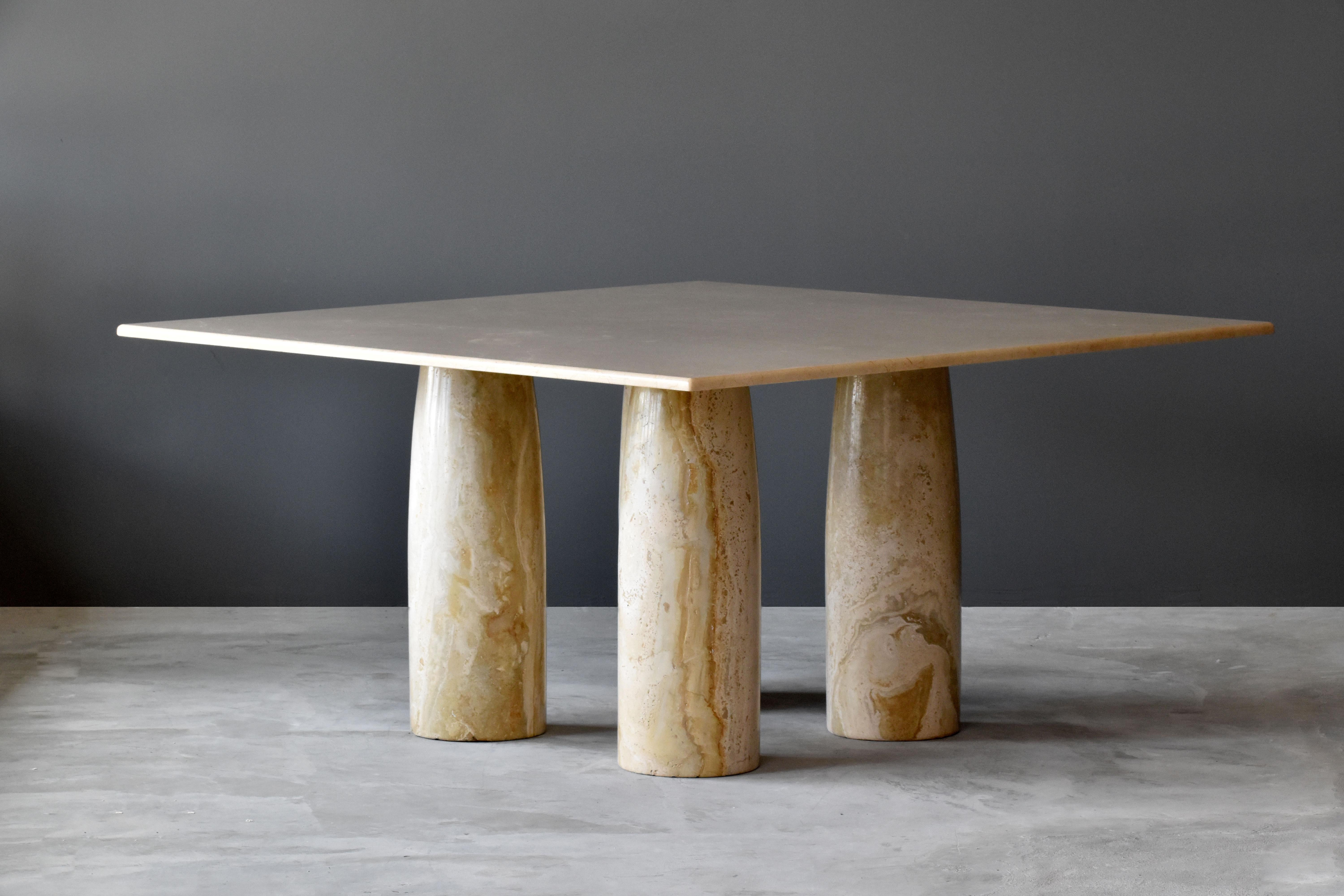 A large dining table designed by Milanese architect Mario Bellini. Produced by Cassina, 1970s. Produced in massive marble. 

Bellini mixes Minimalist form with inspiration from ancient Roman columns. The tabletop rests on modular legs, allowing it's