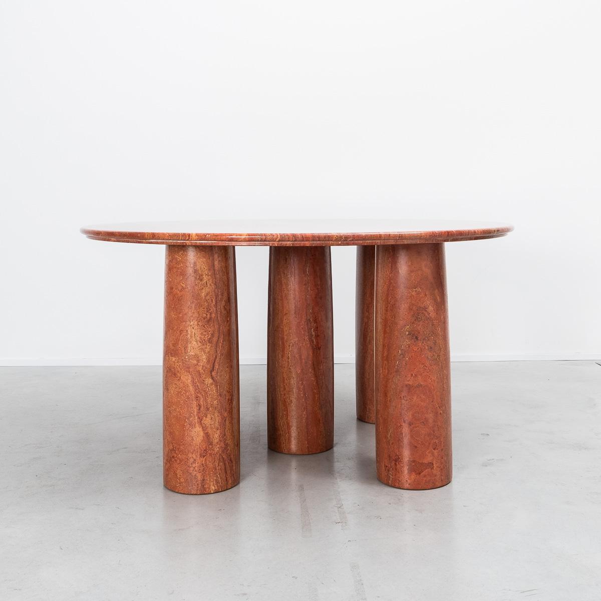 A large round Il Colonnato table, designed by Milanese architect Mario Bellini. The table is a sought after piece, perhaps due to the monumental presence it commands within a space. Minimal in design, with five column legs, it is constructed