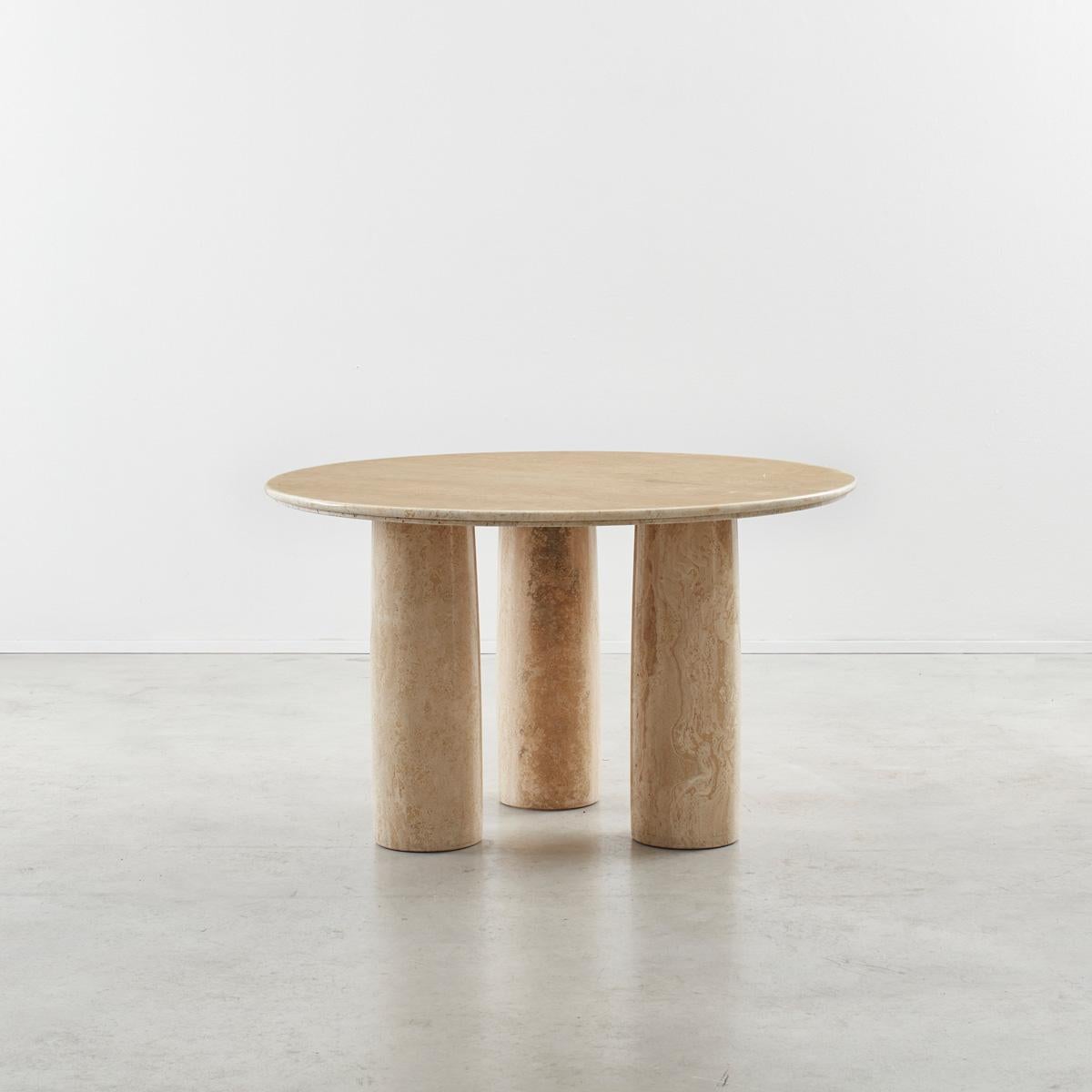 Large round Il Colonnato table, designed by Milanese architect Mario Bellini. The table is a sought after piece, perhaps due to the monumental presence it commands within a space. Minimal in design, with five column legs, it is constructed entirely