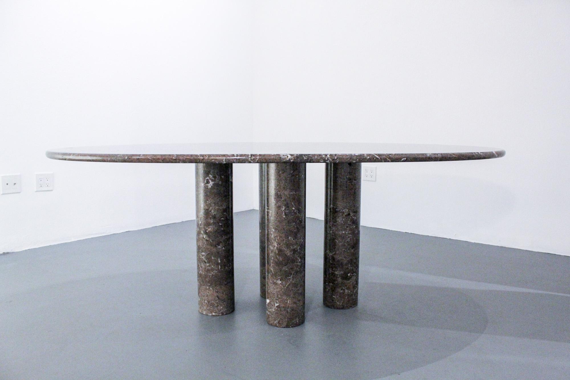 Mario Bellini gray marble Il Colonnato oval table. 

Milanese architect Mario Bellini is well known for creating monumental and conceptual pieces of design, such as the Camaleonda sofa (1971) and Le Bambole. His distinctive architecture and design