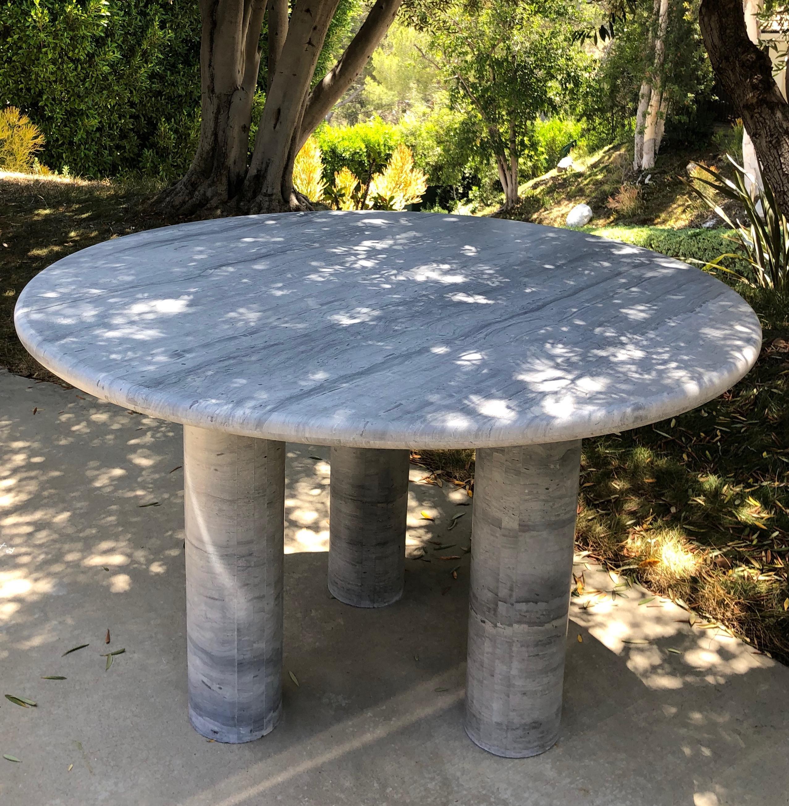 Monumental round dining table for entry or entertaining. Interpreted with moveable legs to personalize this home design statement.