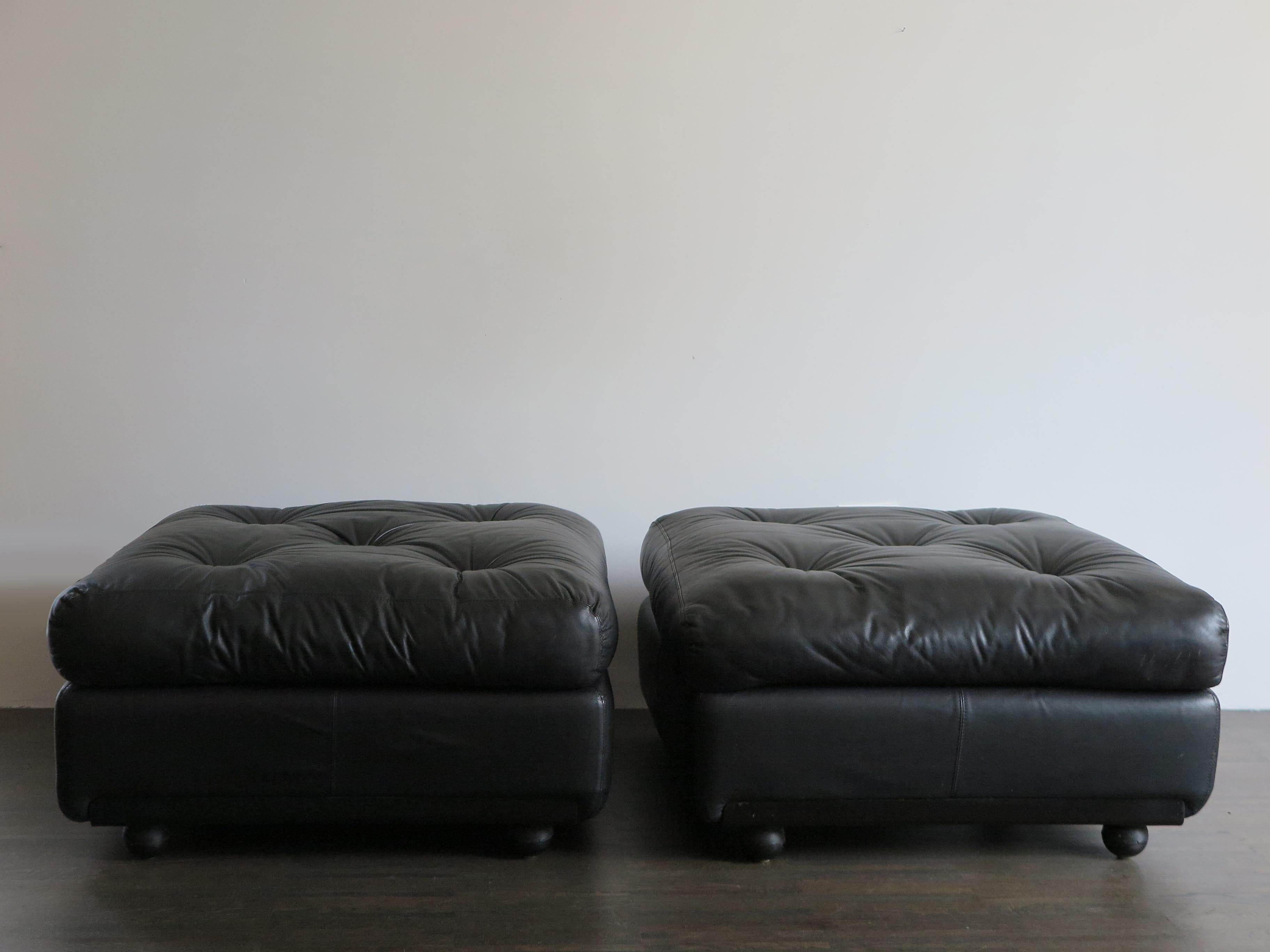 Couple of Italian poufs model Amanta designed by Mario Bellini and produced by B&B Italia with black original leather cushions and upholstery, label and relief print, circa 1970s

Please note that the items are original of the period and this