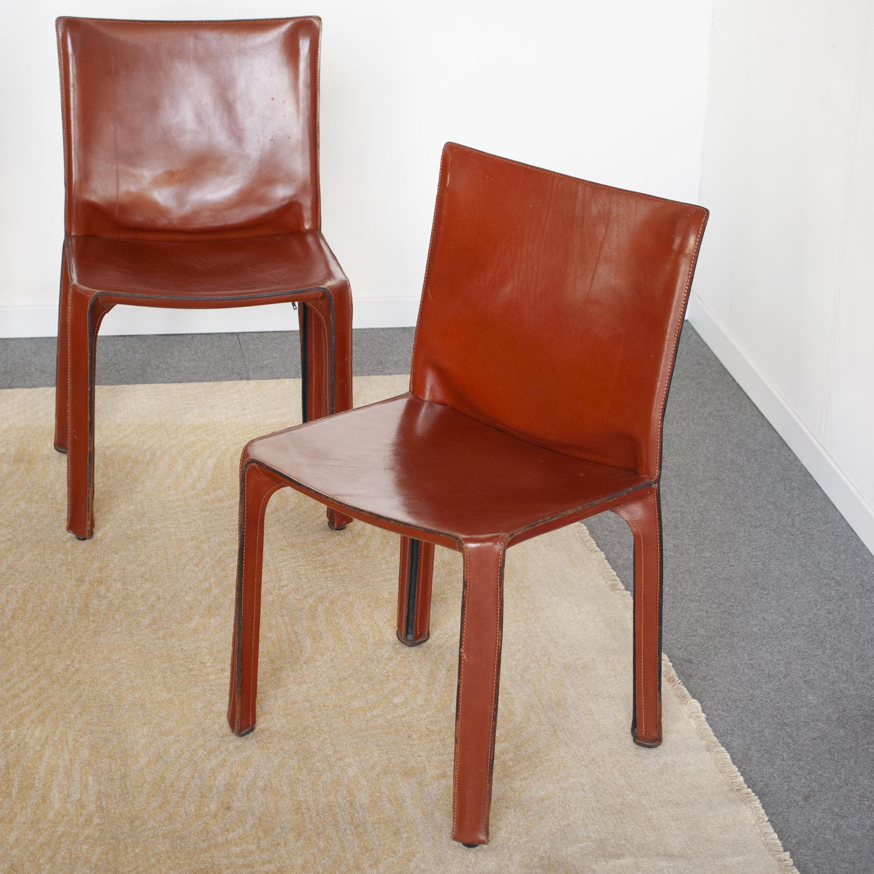 Set of four chairs model 412 D11 Cab produced by Cassina design Mario Bellini, year 1977. Metallic structure and a leather upholstery in leather color closed with hinges.