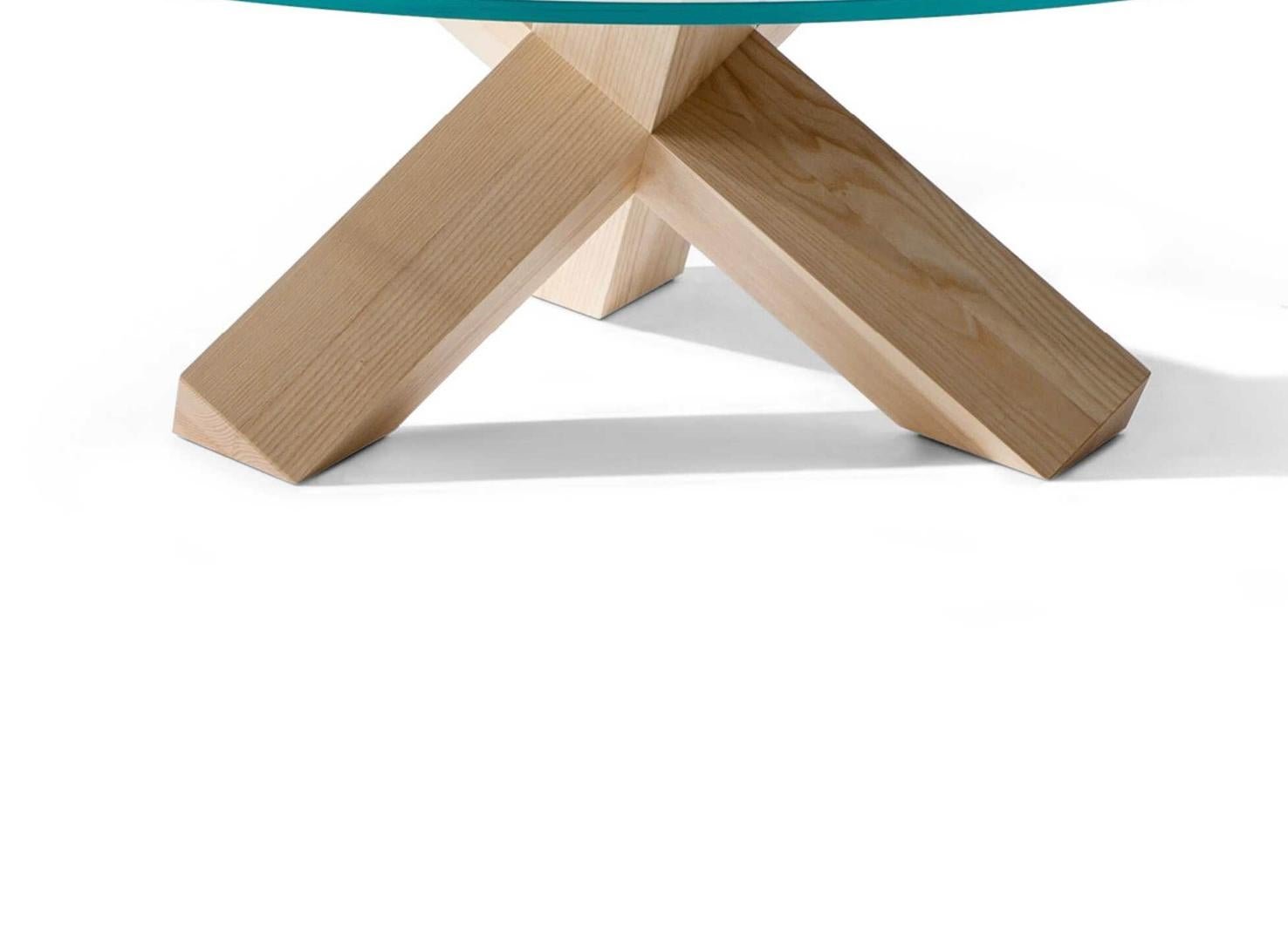 Mario Bellini Set of Two La Rotonda Coffe Table For Cassina

La Rotonda is an iconic design low table that transforms the warmth and essence of solid wood into beauty; a simple sculptural base with three square legs that intersect perpendicularly,