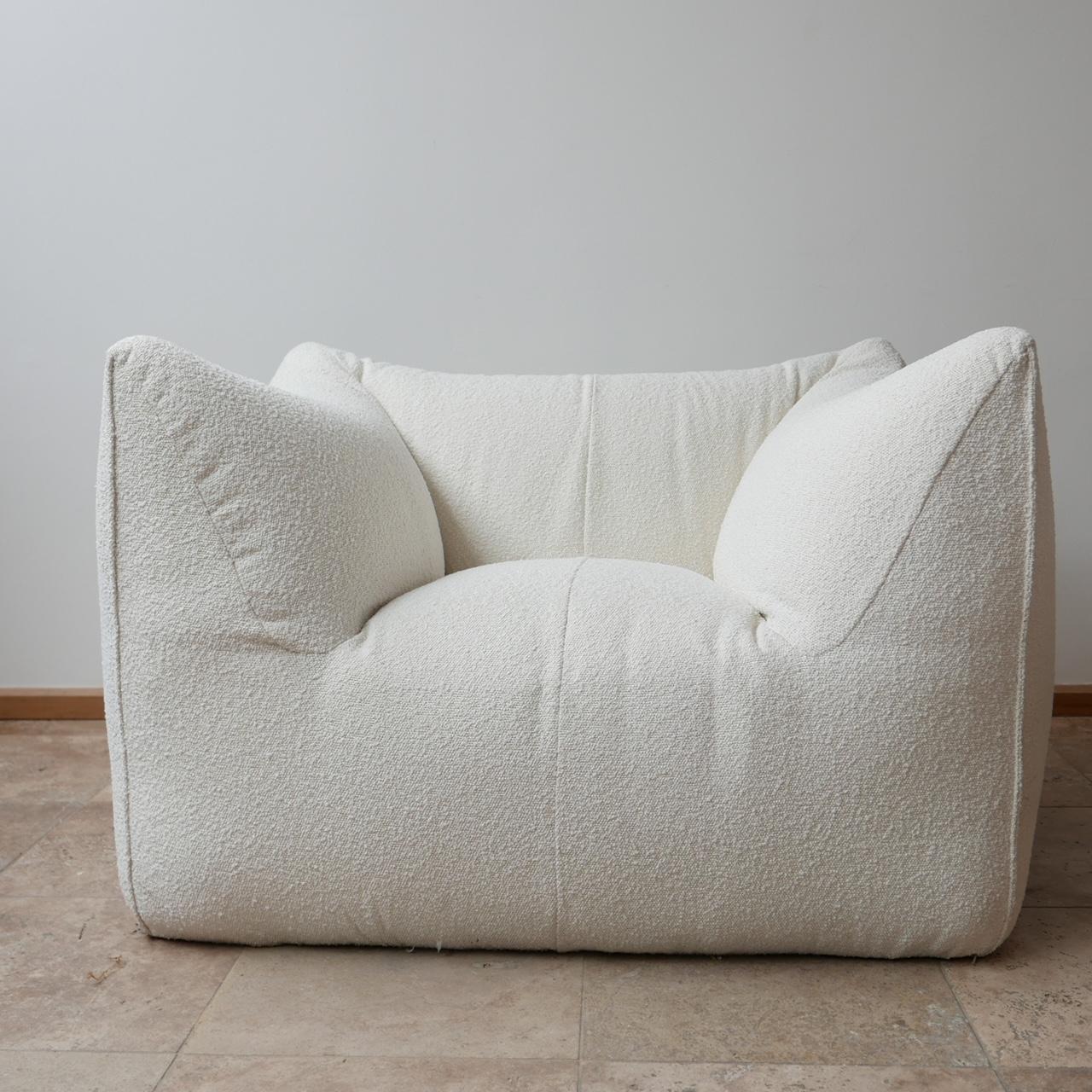 A scarce early Le Bambole armchair by Mario Bellini, esteemed Italian designer.

Italy, circa 1970s.

For B&B Italia.

Re-upholstered in white fabric with the original base retained.

Comfy and flexible as a bedroom or lounge chair, ideal