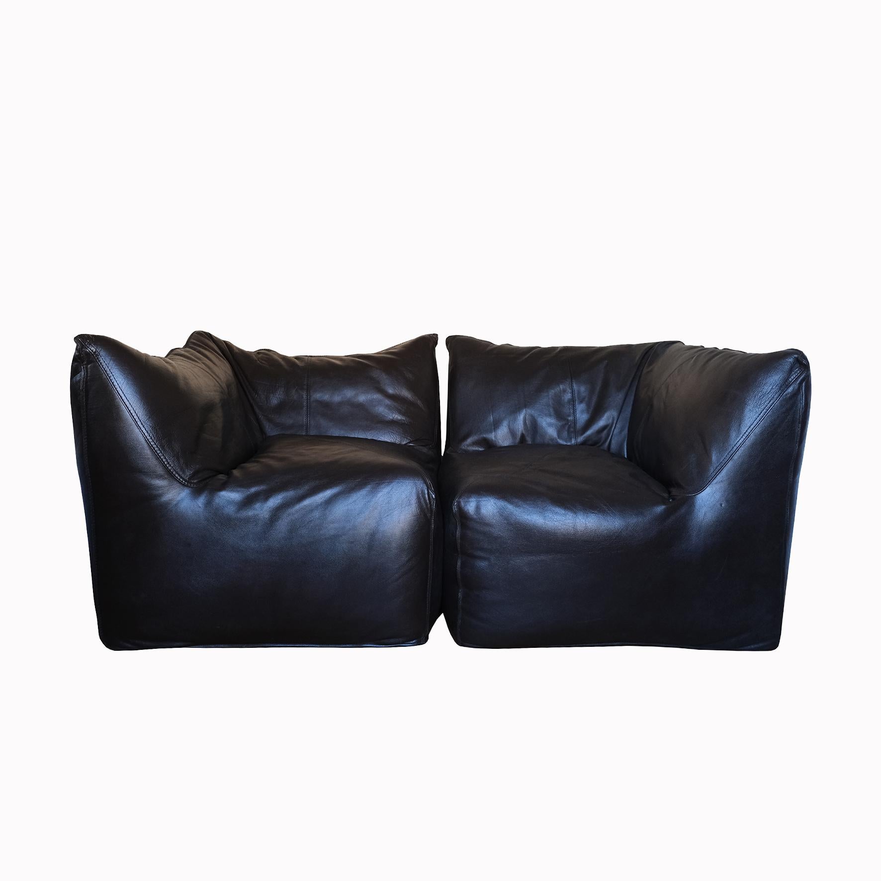 Mario Bellini

Le Bambole

Two armchairs combining to create a sofa, each upholstered with black leather, the internal foam supported with a metal structure. 
Produced by C&B Italia.
Marked underneath.
Circa 1972. Italy.

Literature
Domus,
