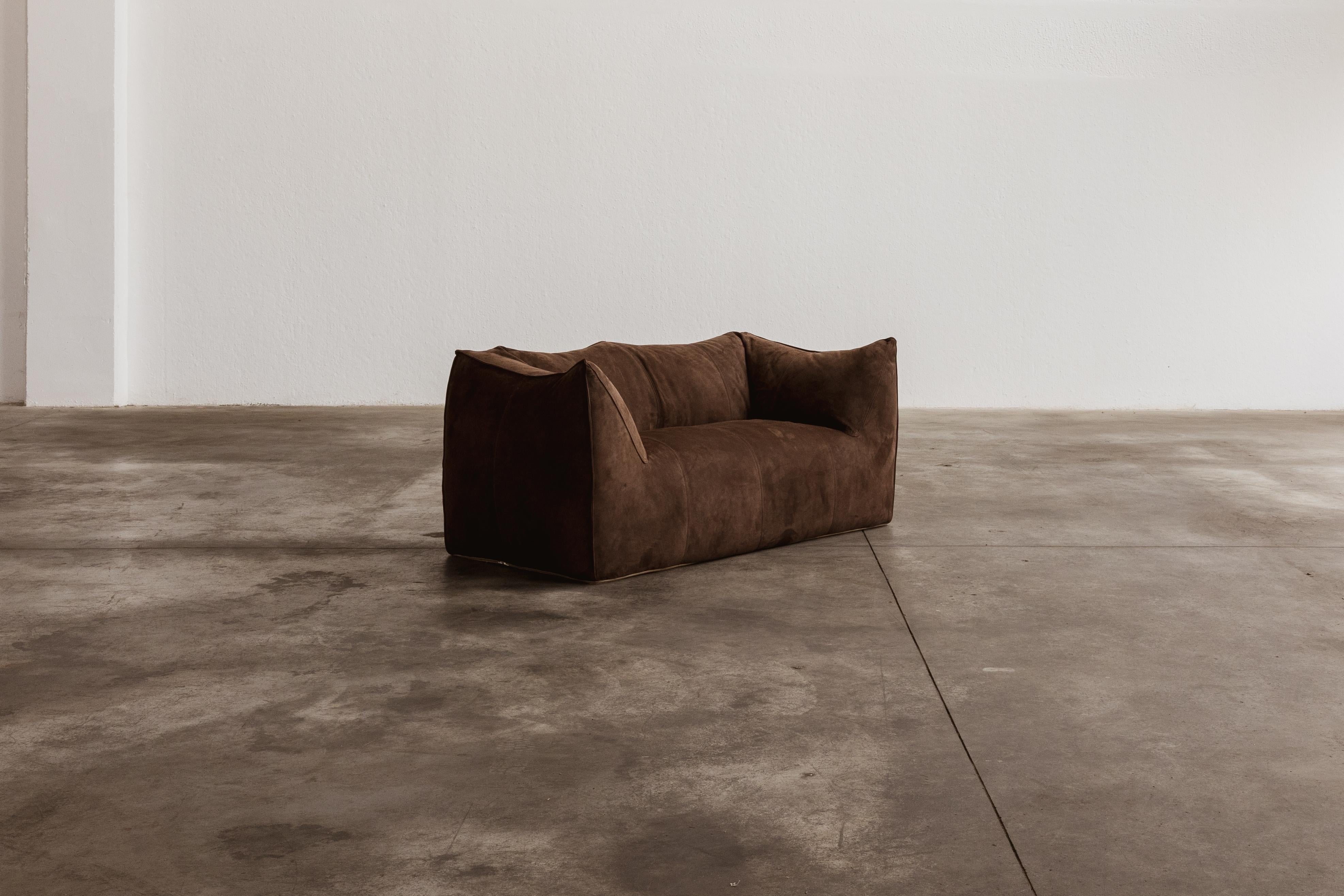 Mario Bellini “Le Bambole” sofa for B&B Italia, dark brown suede, Italy, 1971.

This is a timeless Postmodern design icon. The starting point was a shopping bag containing formless material shaped when the bag was set on the ground and squashed. In