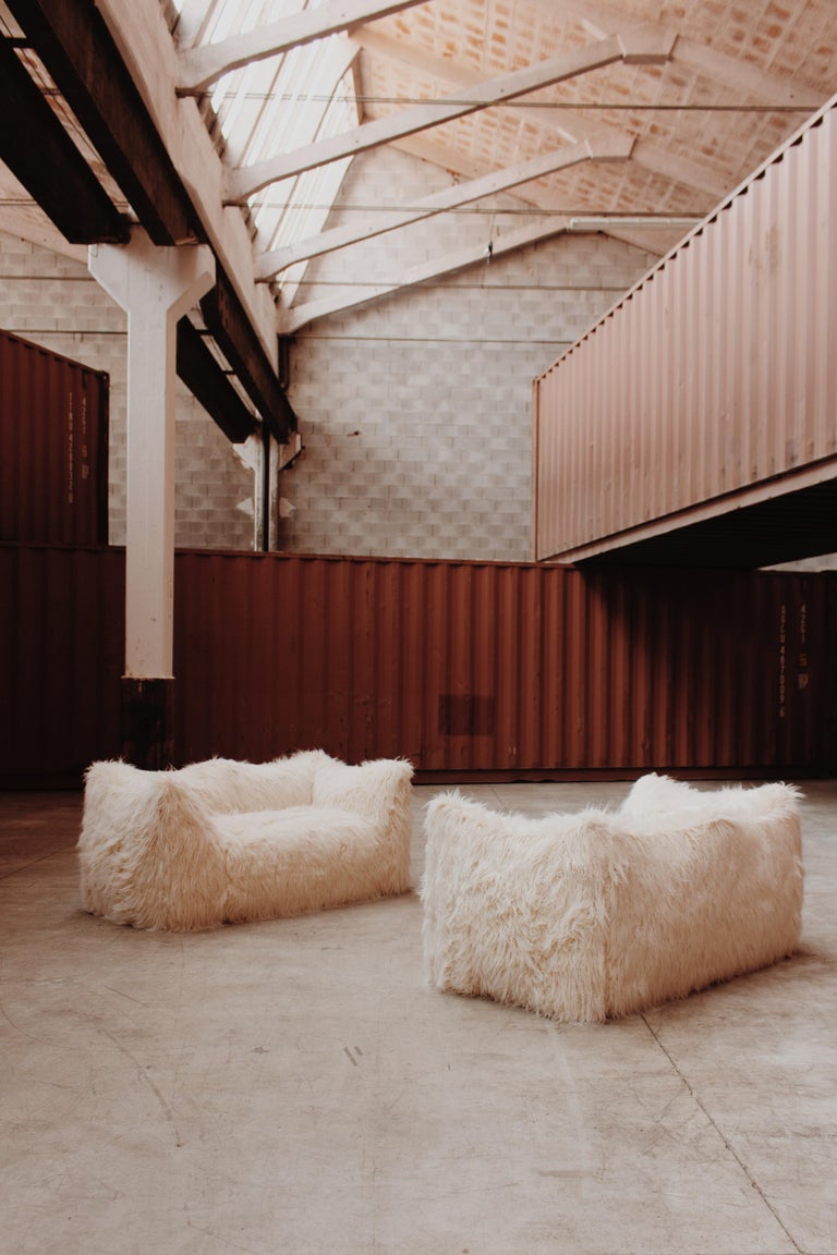 Mario Bellini “Le Bambole” two-seater sofa for B&B Italia, Mongolian faux-fur, Italy, 1971, set of two.

This is a timeless Postmodern design icon. The starting point was a shopping bag containing formless material shaped when the bag was set on the