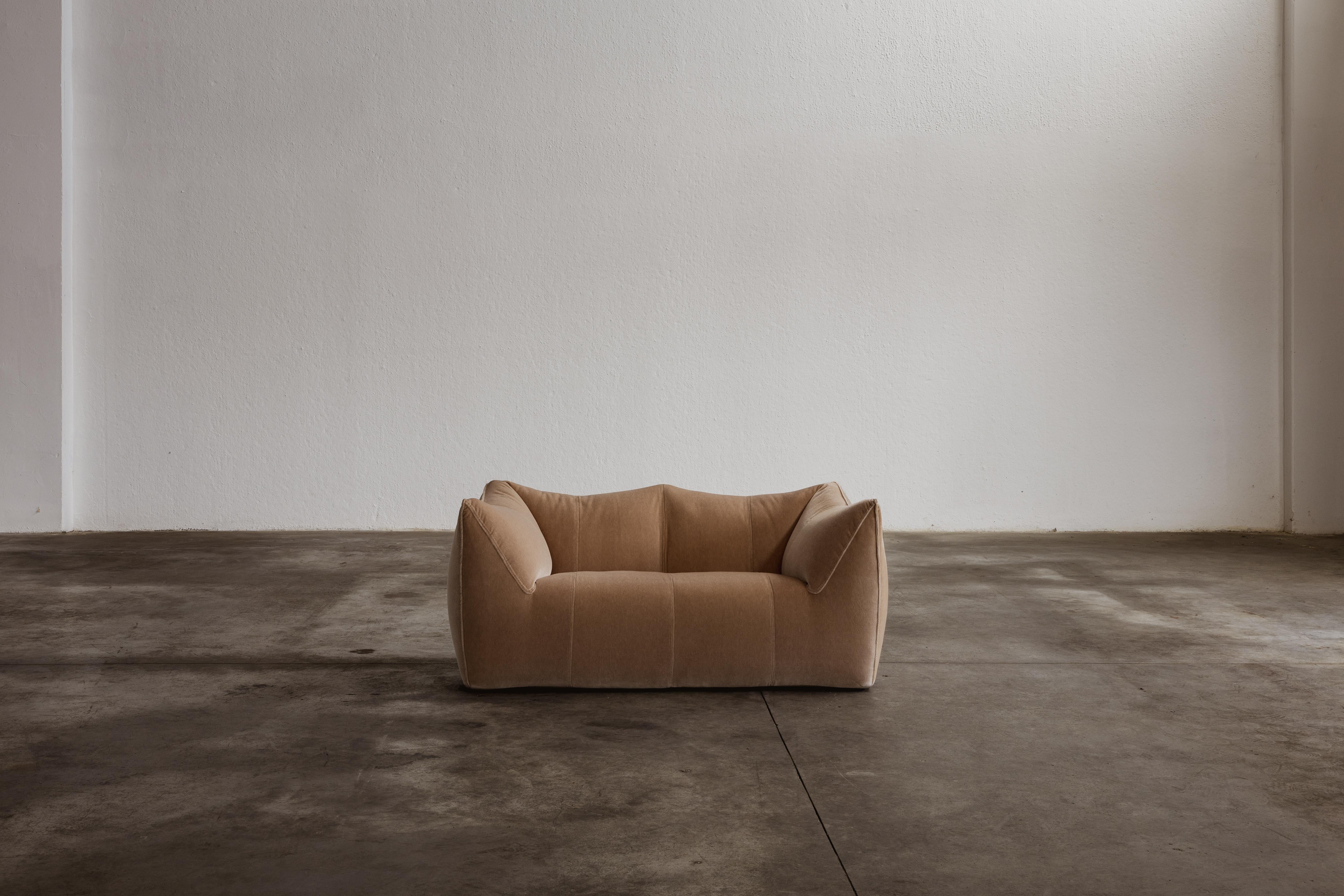 Mario Bellini “Le Bambole” two-seater sofa for B&B Italia, camel velvet, Italy, 1971.

This is a timeless Postmodern design icon. The starting point was a shopping bag containing formless material shaped when the bag was set on the ground and