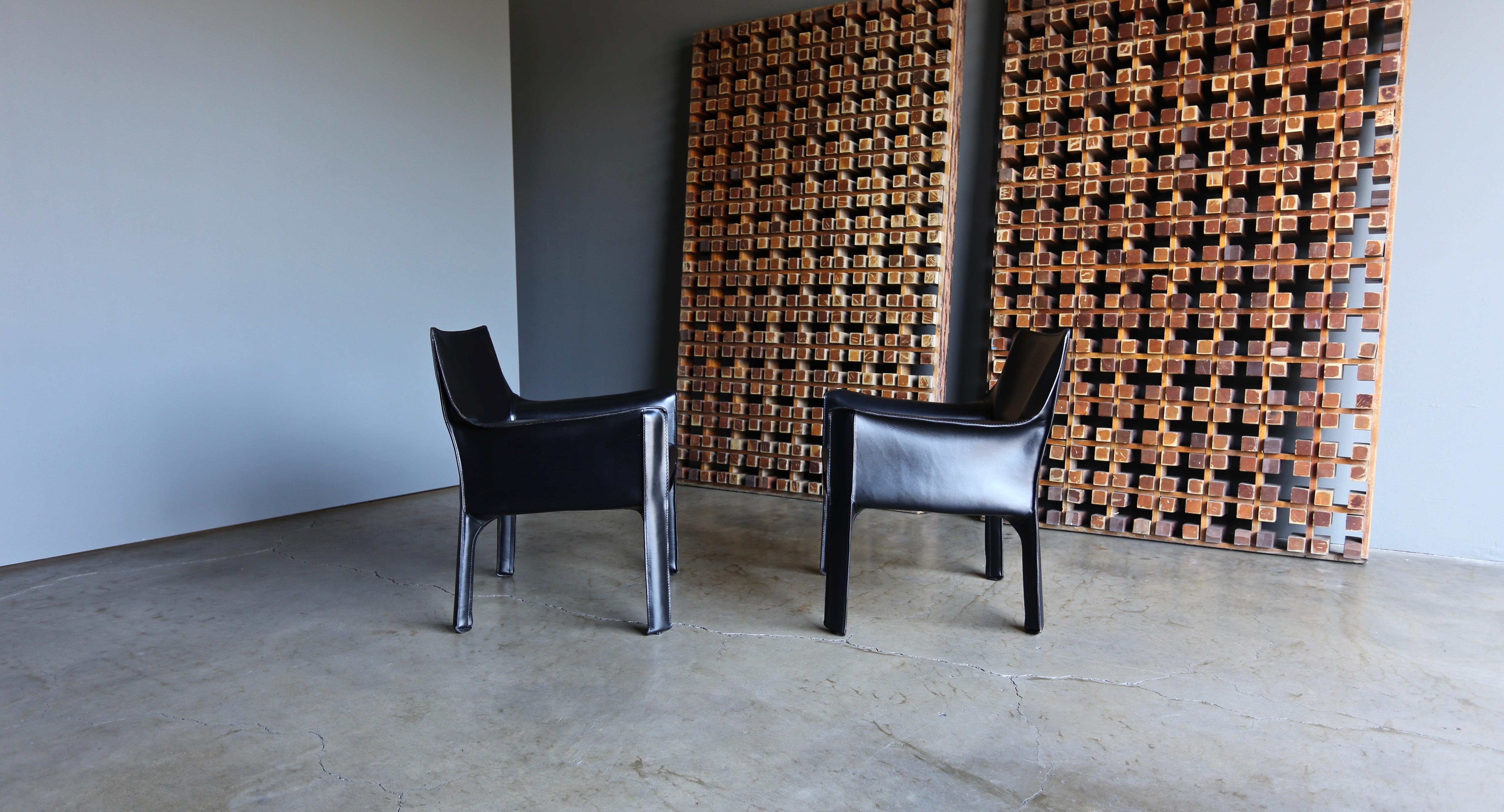 Mario Bellini 414 black leather cab lounge chairs for Cassina. This pair is in very good original condition.