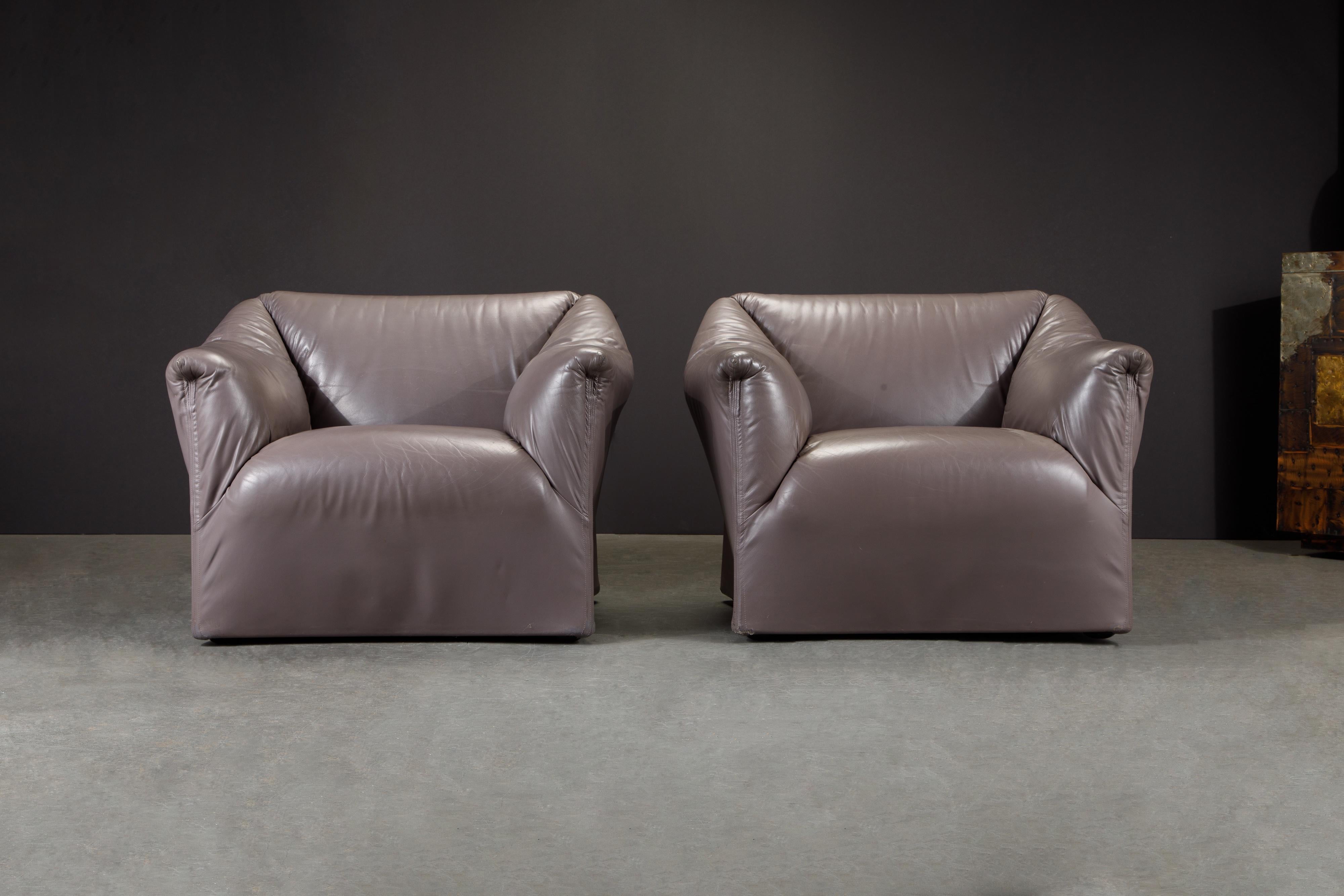 A beautiful pair of Mario Bellini for Cassina 'Tentazione' club chairs in a gorgeous deep colored leather. Priced as a pair, these model 685 lounge chairs were distributed by Atelier International, who were the US distributors for Cassina in the