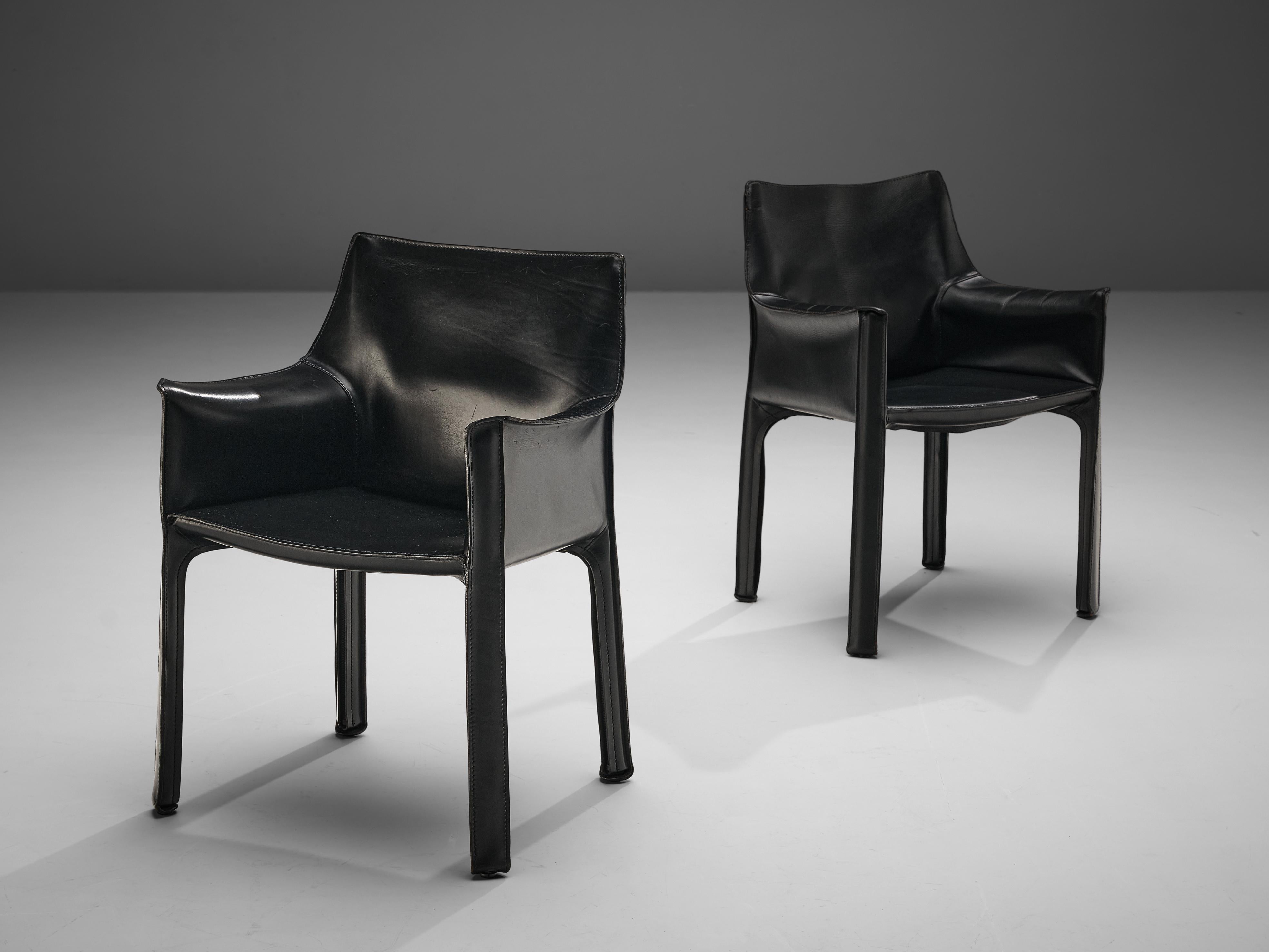 Mario Bellini for Cassina, pair of armchairs model ‘CAB 413’, leather, plastic, Italy, design 1979

The iconic ‘CAB’ chairs were designed by Mario Bellini in 1979. Conceptually new was the way Bellini uses leather to cover the whole chair in one