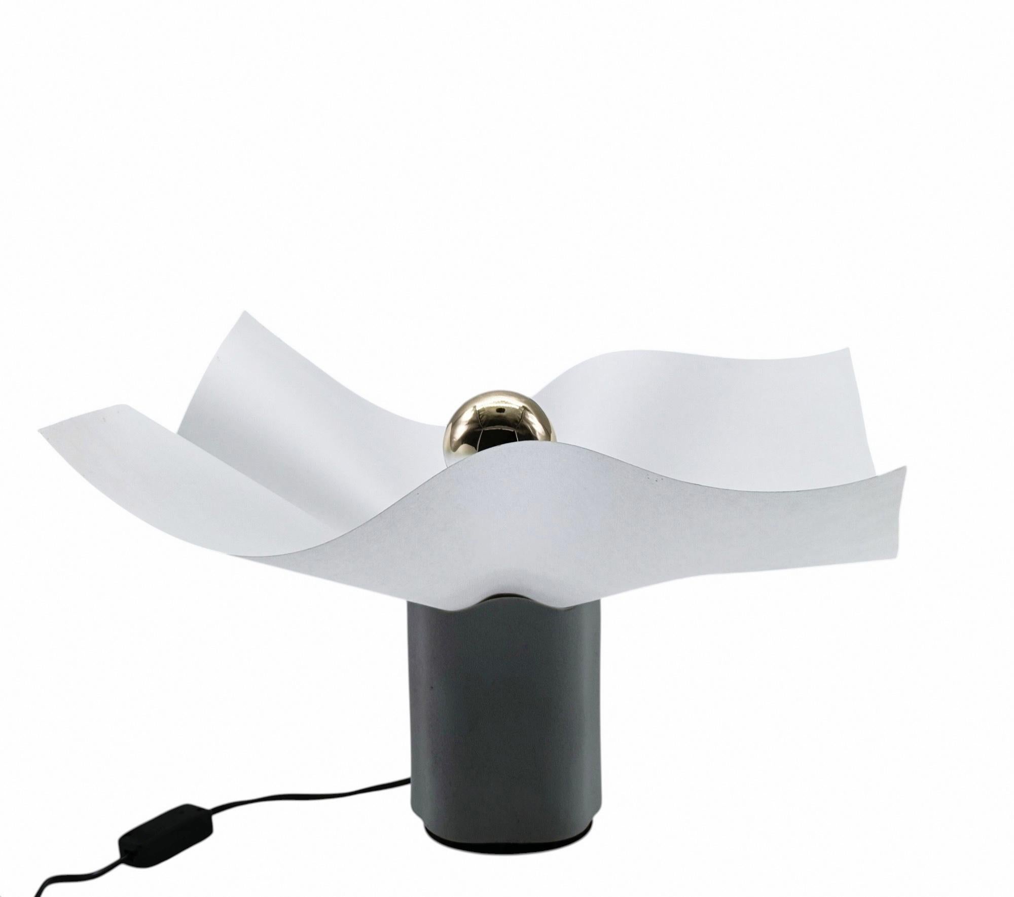 Rare and Iconic Mario Bellini Area 50 Table Lamp by Artemide, Italy.
It features a beautiful white ceramic base with rough edges and a distinctive paper-resin lampshade. Very good condition. 