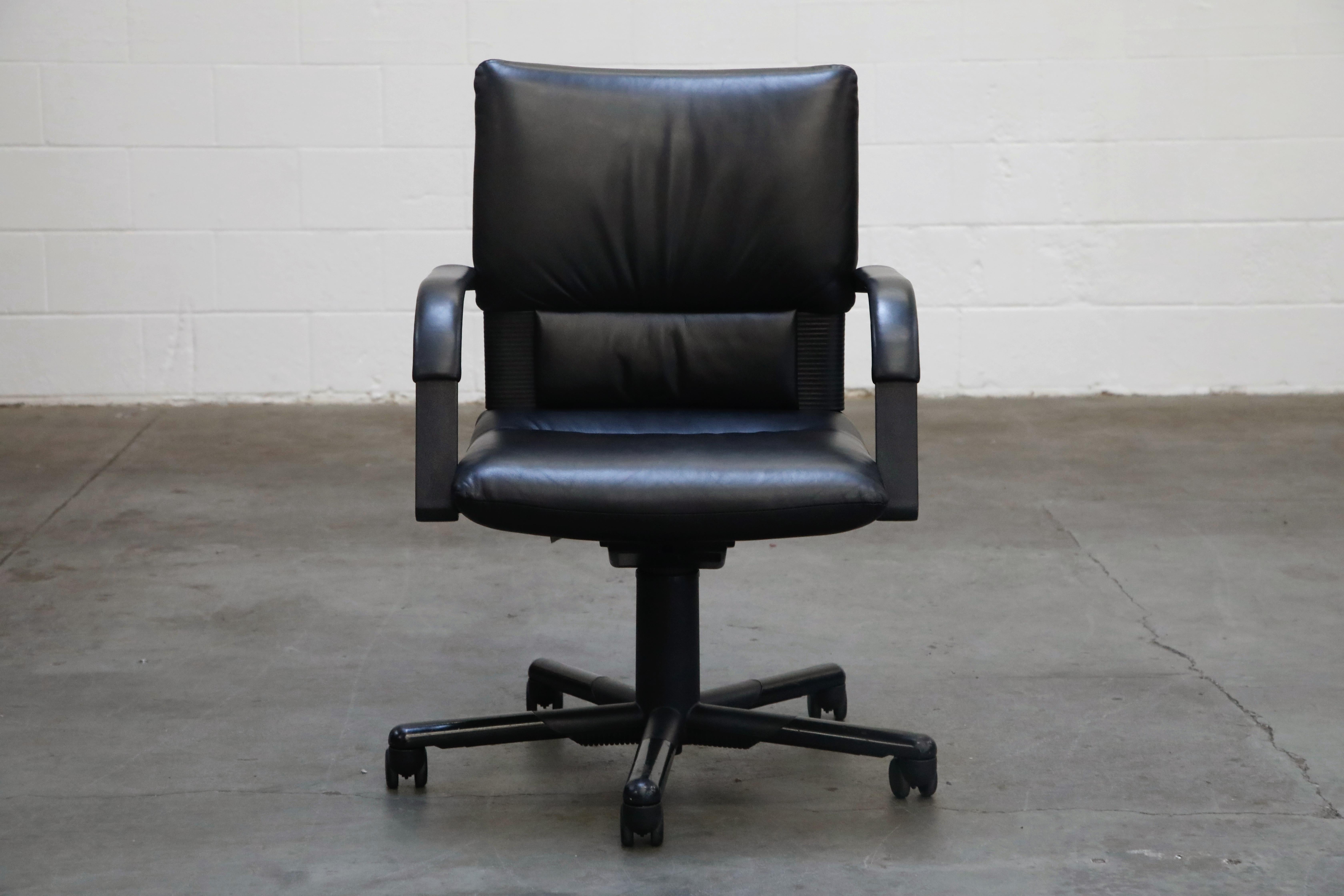 A spectacular set of Mario Bellini signed desk chairs for the Vitra, dated 1992 production. This Post Modern set of task chairs feature soft and supple black leather in excellent condition, five star height adjustable bases on casters, and are
