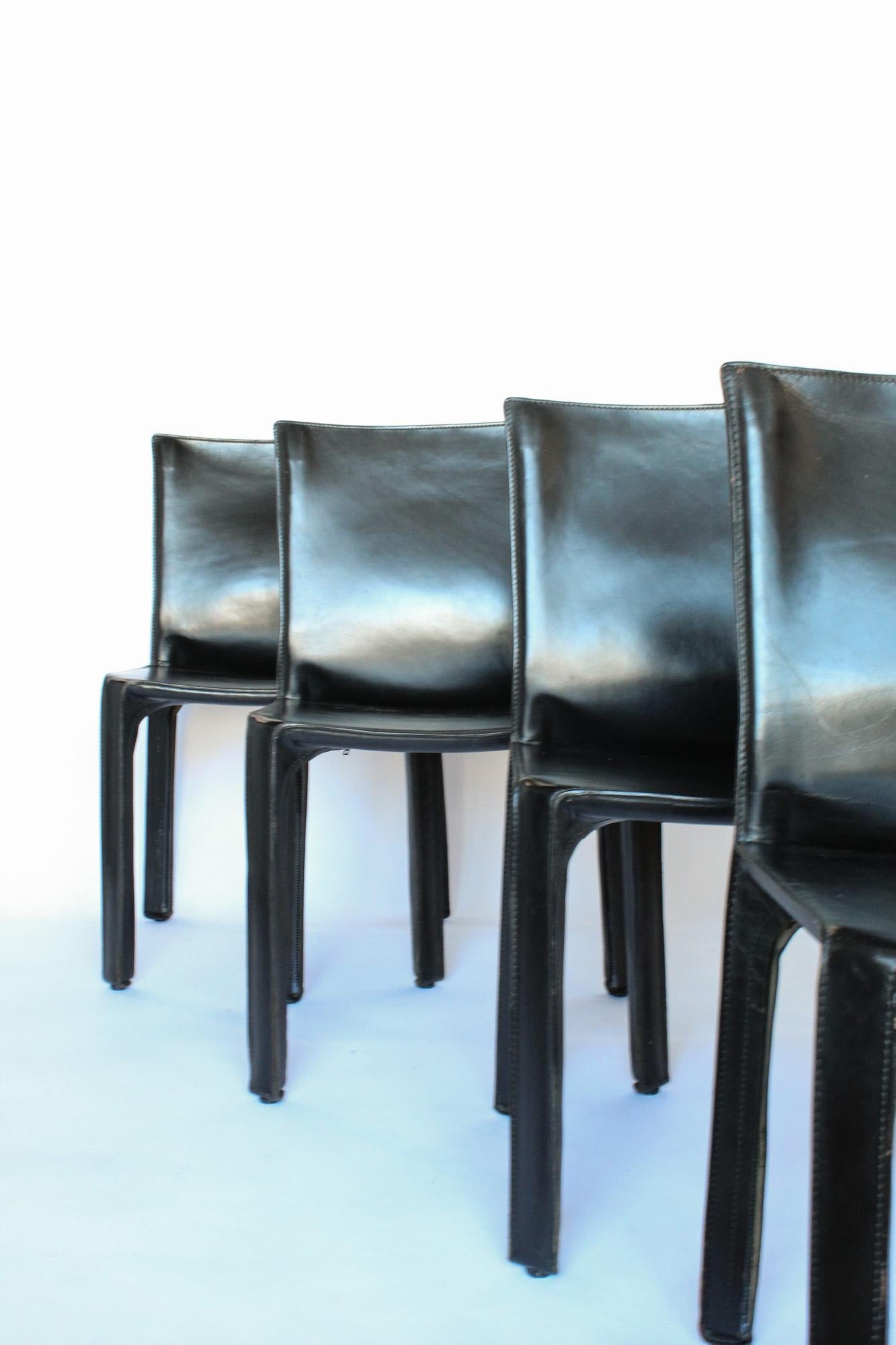 Beautiful 1970s Cab chairs, designed by Mario Bellini for Cassina. 

The Cab chair for Cassina, is made of 16 individual pieces of saddle leather that create a “skin” over a minimal metal frame.
Chairs are structurally in excellent vintage