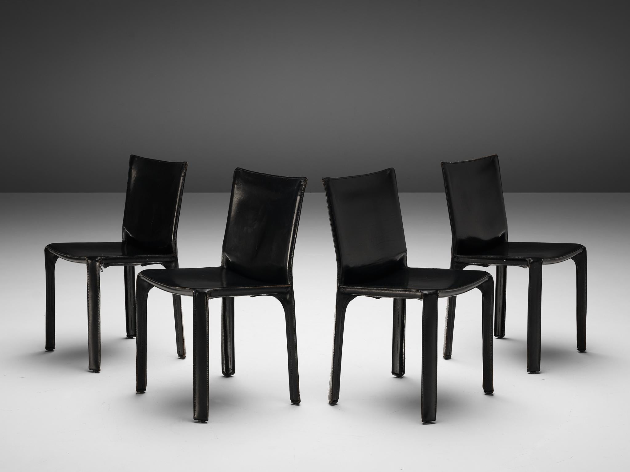 Mario Bellini for Cassina, set of four 'cab' dining chairs model 412, black leather, Italy, 1976

Conceptually, the chair was designed to become marked and shaped over time by its user. The leather skin fits like a glove over the steel skeleton and