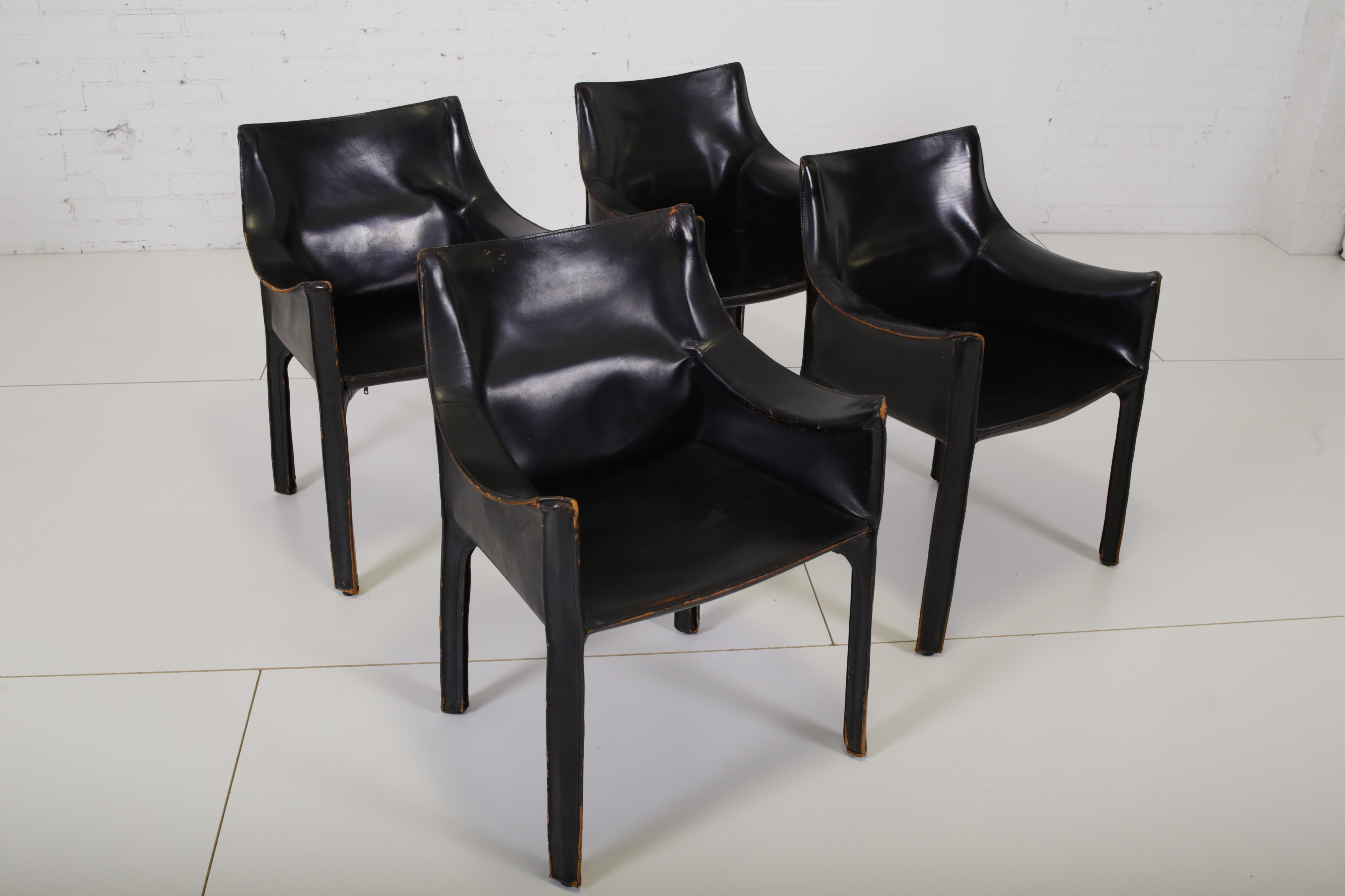 Set of 4 CAB chairs by Mario Bellini. Black leather arm chairs, circa 1970s, for Cassina.