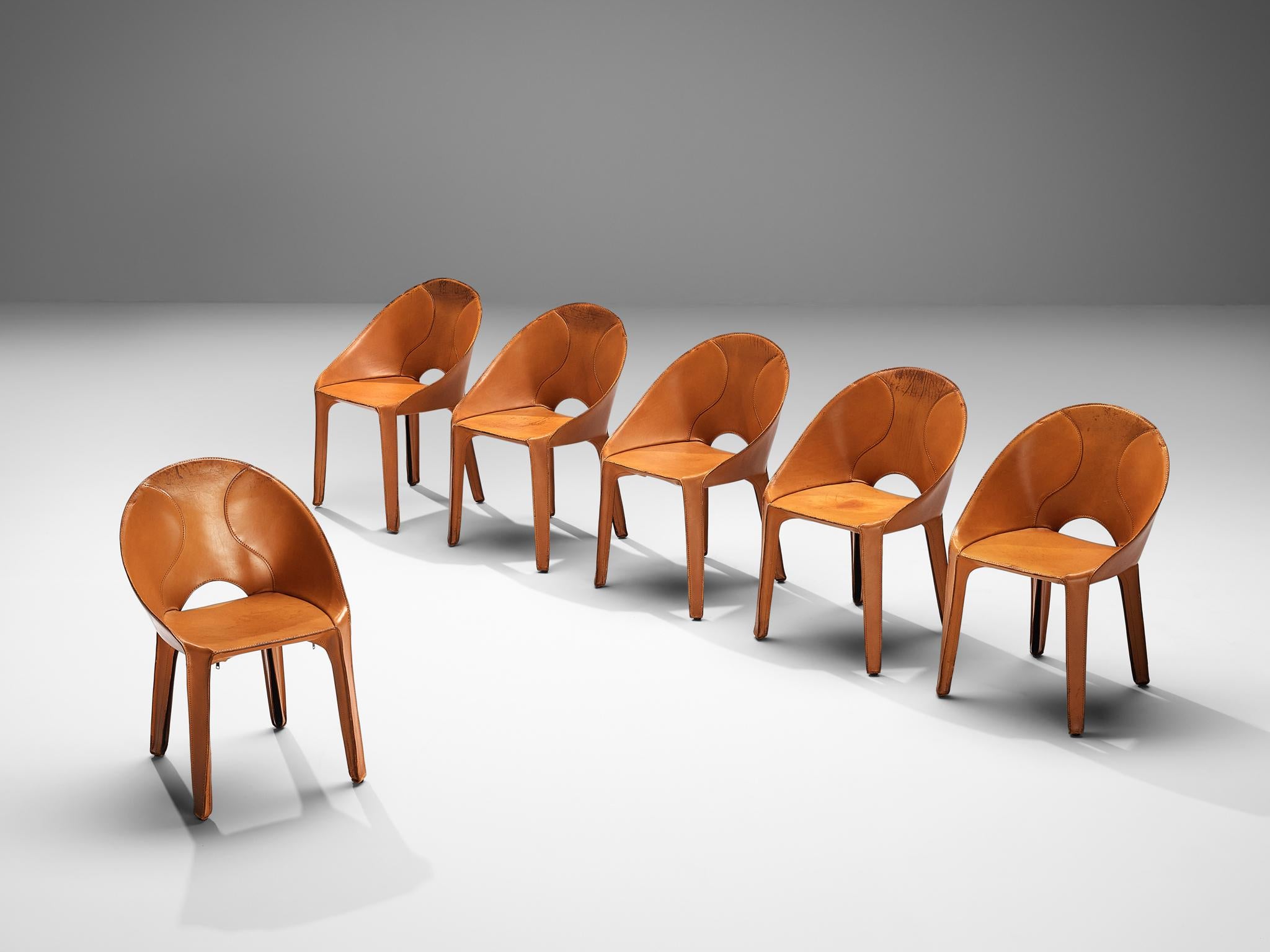 Mario Bellini for Cassina, set of six ‘Lira e Liuto’ dining chairs, cognac leather, Italy, 1989

This set of six ‘Lira e Liuto’ dining chairs has beautiful cognac colored leather that is stitched to the seats of these chairs. The four legs and the
