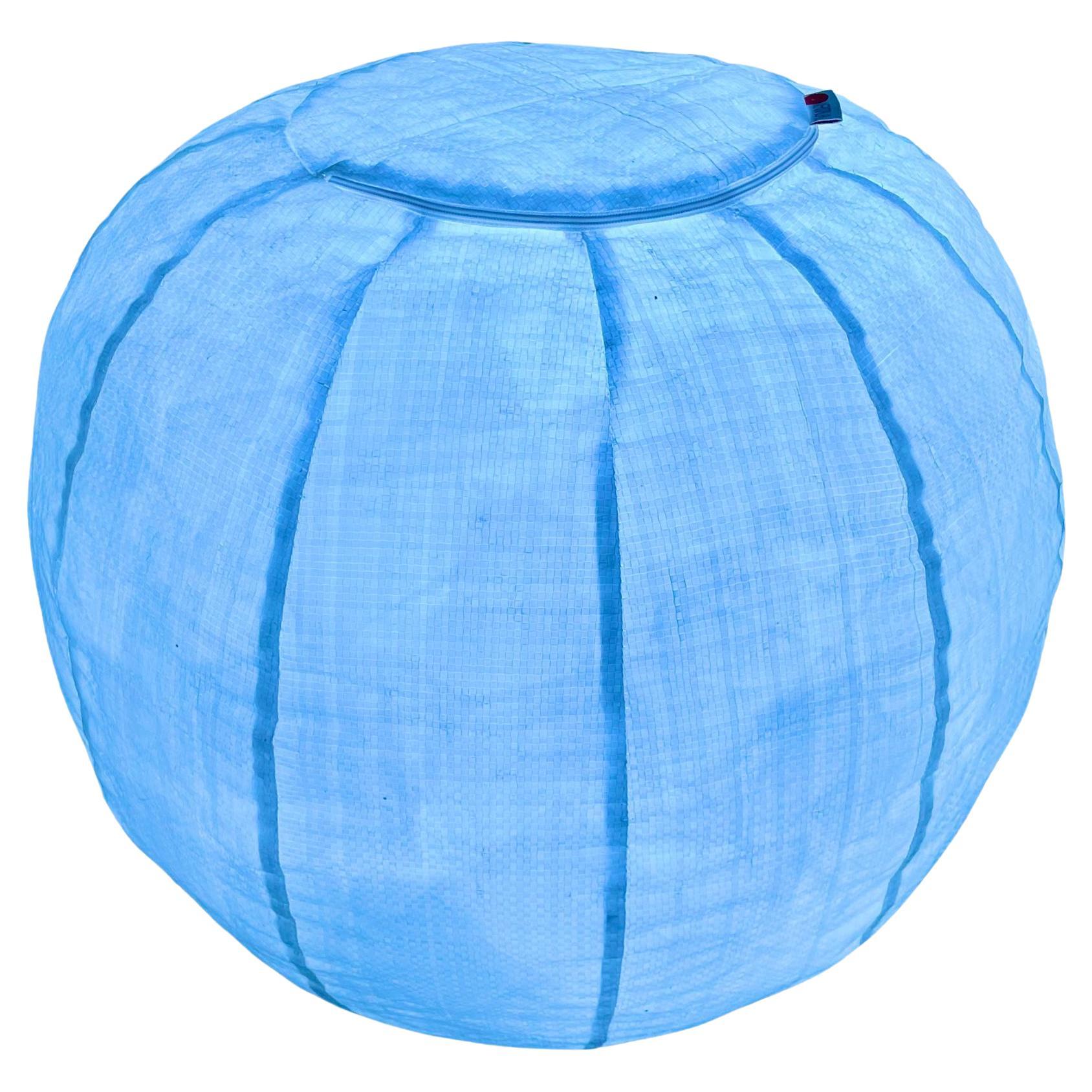 Stunning woven palstic pouf by Mario Bellini with built in LED lights. Made for Meritalia in 2000s. Original label still attached. Mesh pouf is filled with hundreds of air filled shipping packets. This Meritalia collection is based around the body's