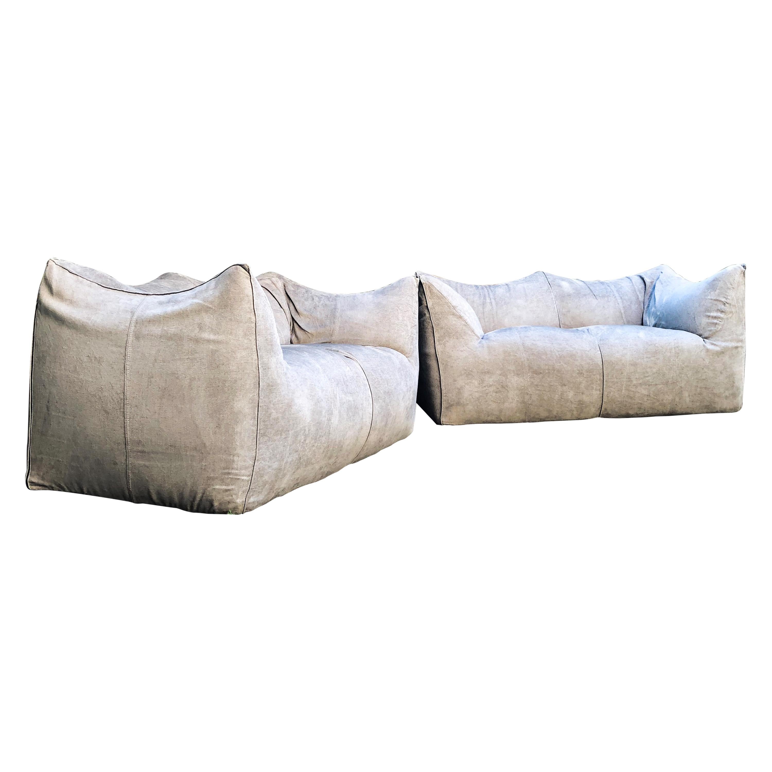 Set of 2 “Bibambola” sofa designed by Mario Bellini for B&B Italia. 
Original vintage version from 1976 recently reupholstered by the previous owner with a light grey fabric.
This comfortable settee is bulky and playful, shaped as if it is merely