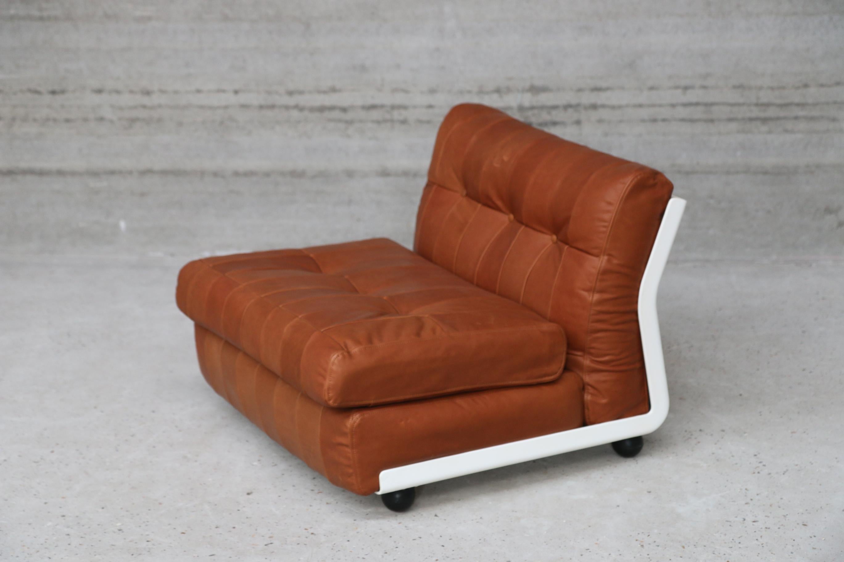 Vintage signed and stamped B&B Italia Mario Bellilni. Bellalu upholstered this midcentury design gem with their signature unique natural vegetal tainted aniline full grain leather. We gave the design a twist by using a patchwork leather upholstery