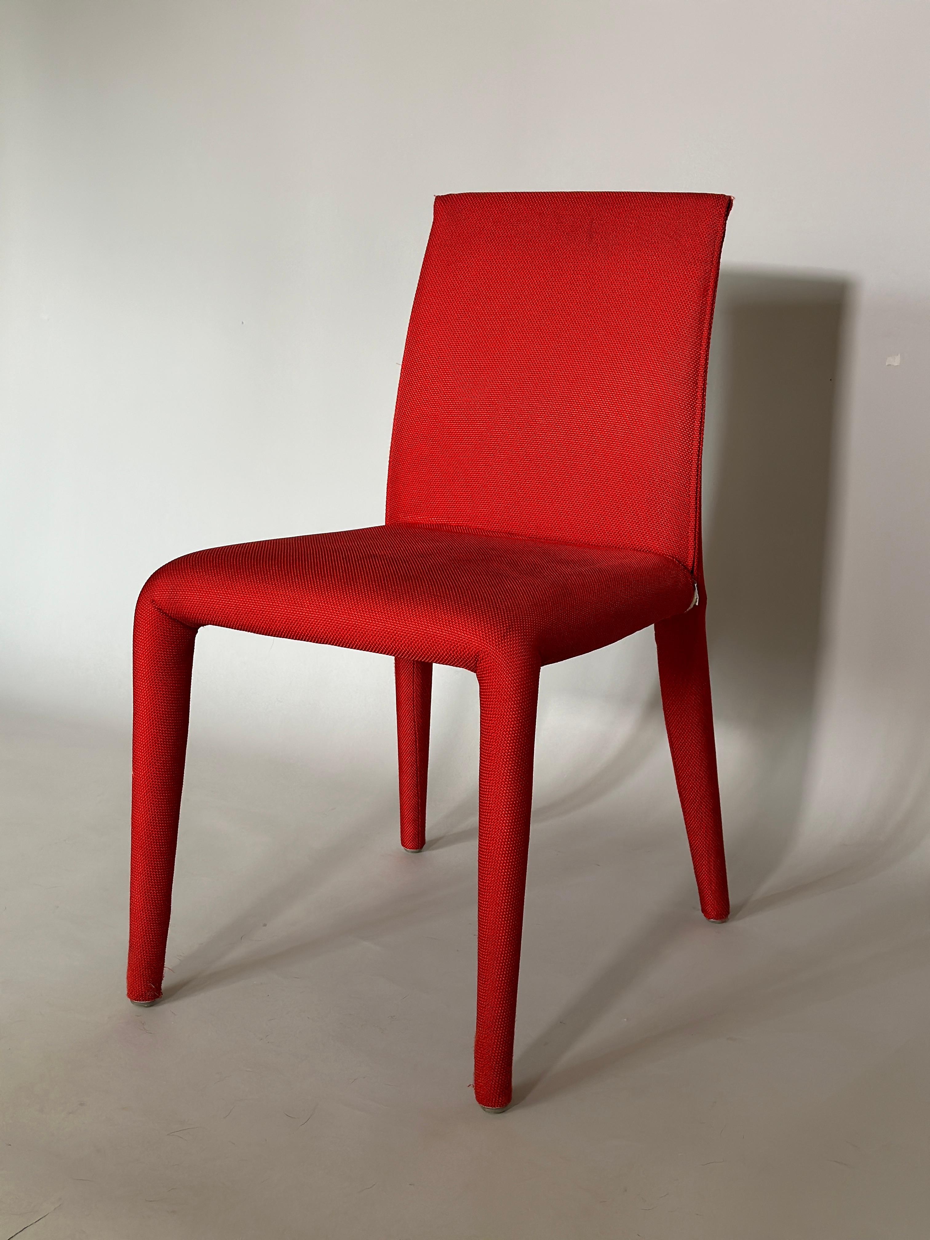 Set of four dining chairs in red fabric by Mario Bellini for B&B Italia. 
Modern design, faboulos red dining chairs.