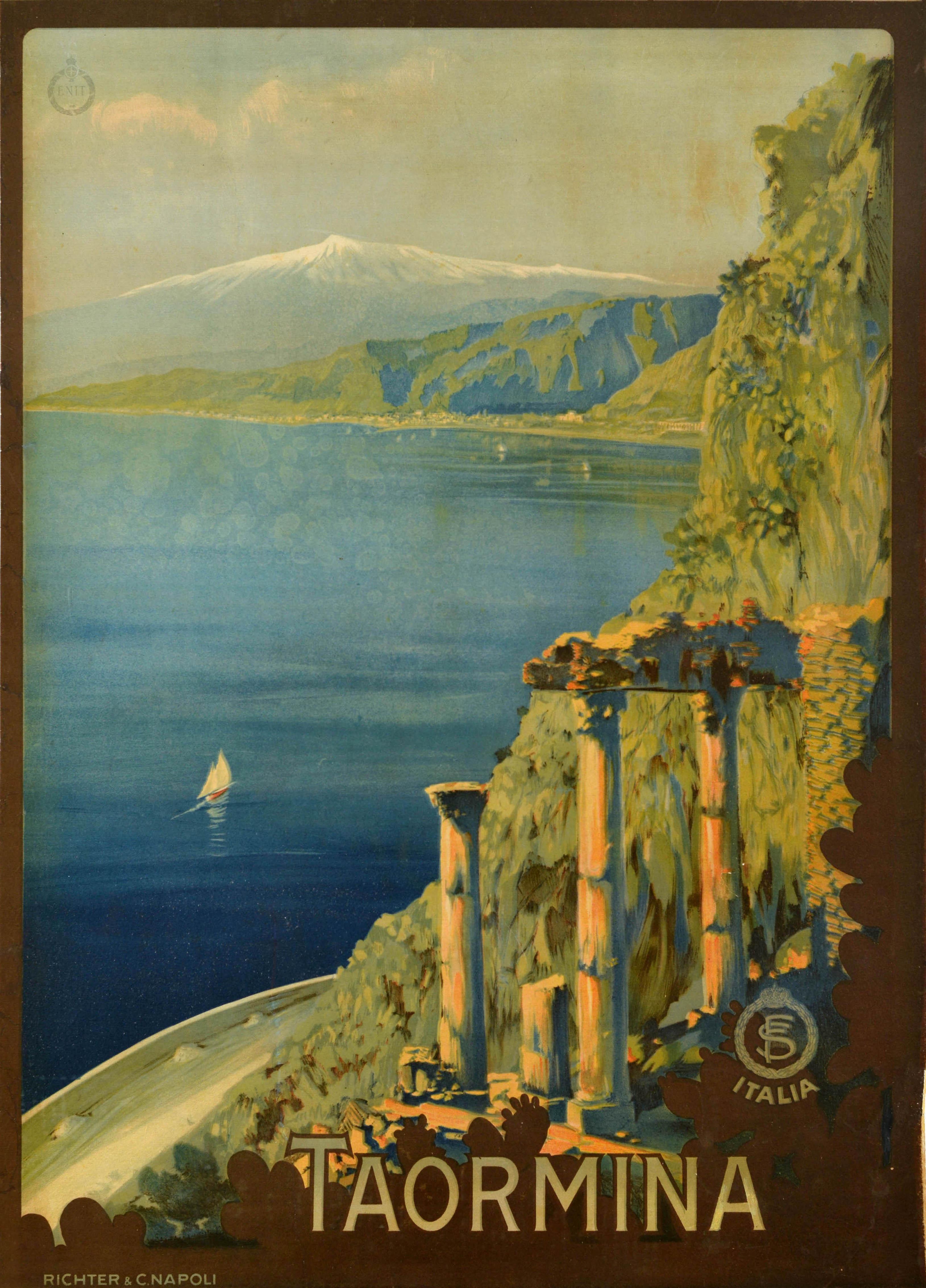 Original vintage travel poster Taormina Italia featuring stunning artwork of the hilltop town in Sicily with a view over the ancient ruins and sailing boats on the calm blue sea leading around the coast to a snow topped Mount Etna in the distance,