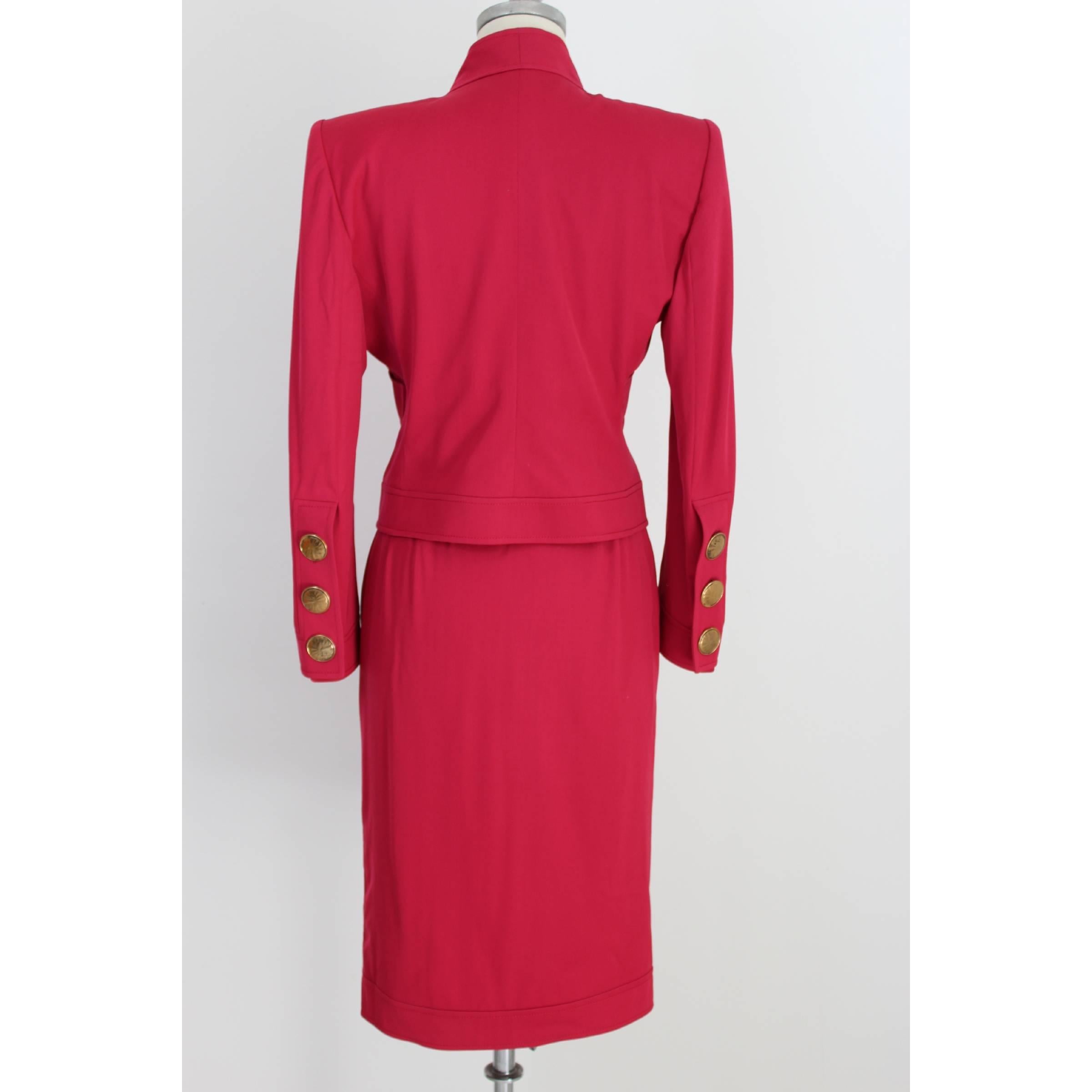 Mario Borsato women's skirt suit. Fuchsia color. The slim fit model jacket, with large gold-colored buttons, two side pockets. Sheath skirt model has a gold-colored button on the edge. Made in Italy. New with tag.

Size: 44 IT 10 US 12 UK

Shoulder: