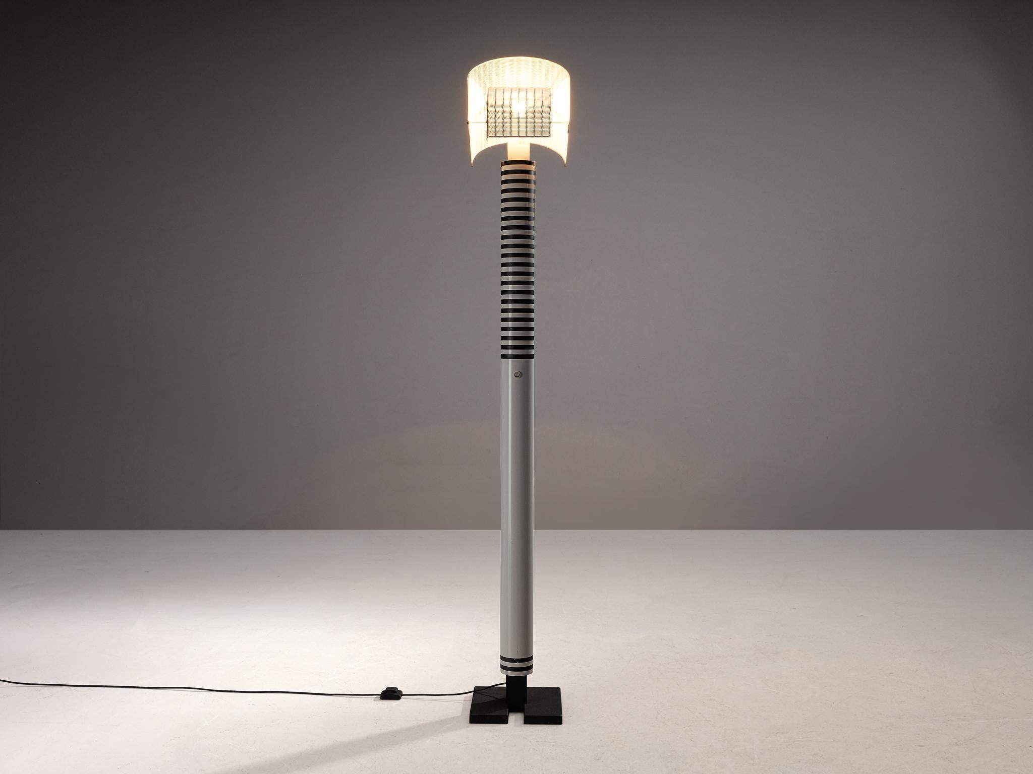 Mario Botta for Artemide, 'Shogun' floor lamp, aluminum, steel, Italy, 1986 

Mario Botta referred to lamps as “people”. He said “Shogun is a person. He has a head, body and feet, plus he has a navel.” The designer is known for his use of geometric