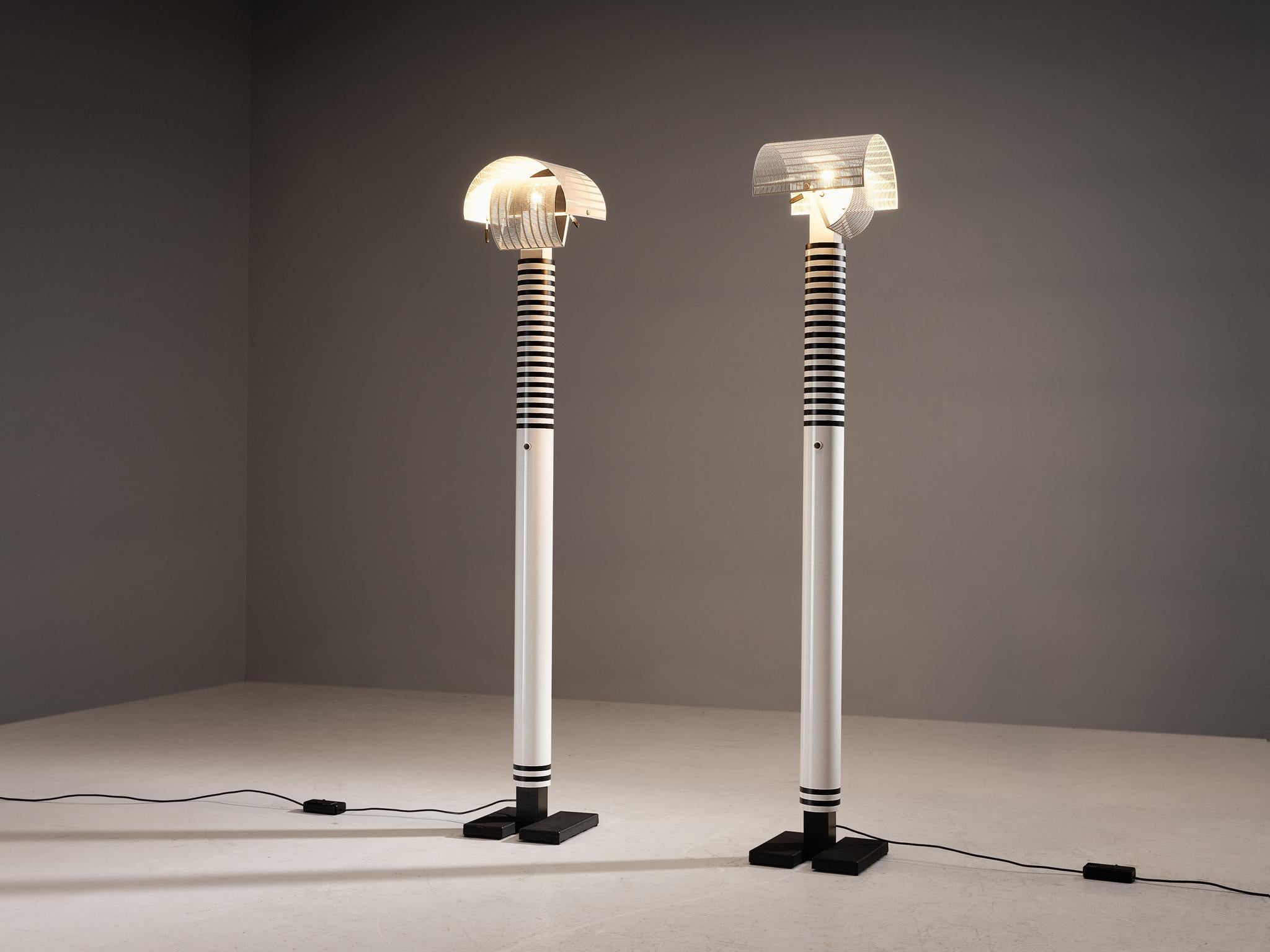 Mario Botta for Artemide, 'Shogun' floor lamps, aluminum, steel, Italy, 1986 

Mario Botta referred to lamps as “people”. He said “Shogun is a person. He has a head, body and feet, plus he has a navel.” The designer is known for his use of geometric