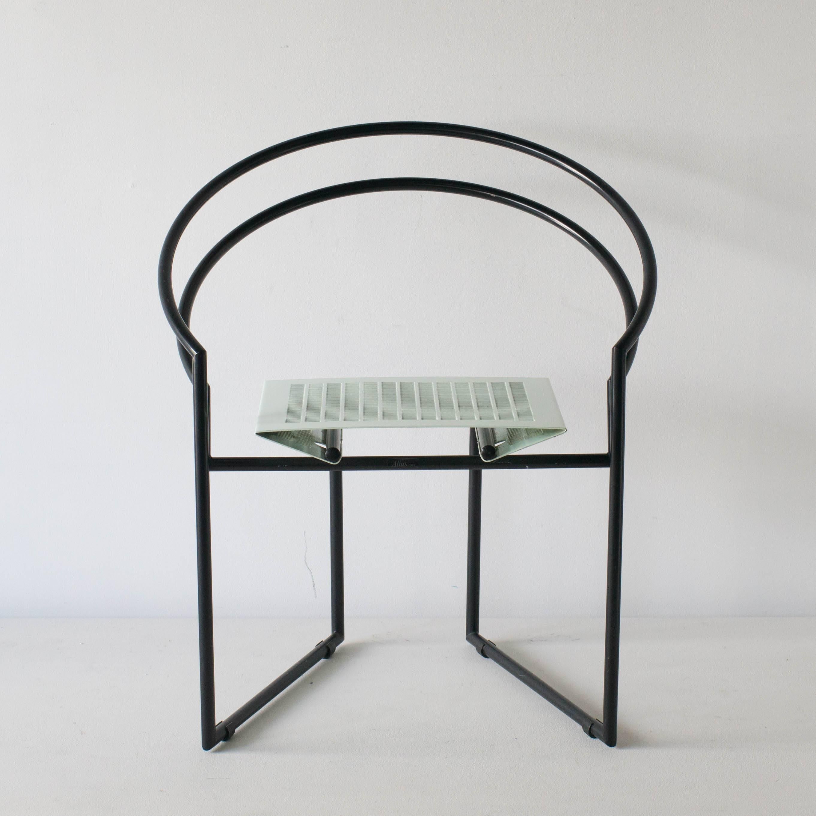 Latonda chair by Italian architect Mario Botta. Black steel pipe frame and peppermint bent punching metal sheet seat and back. It has very interesting form, but comfortable sitting. Four chairs available. Price is for each.