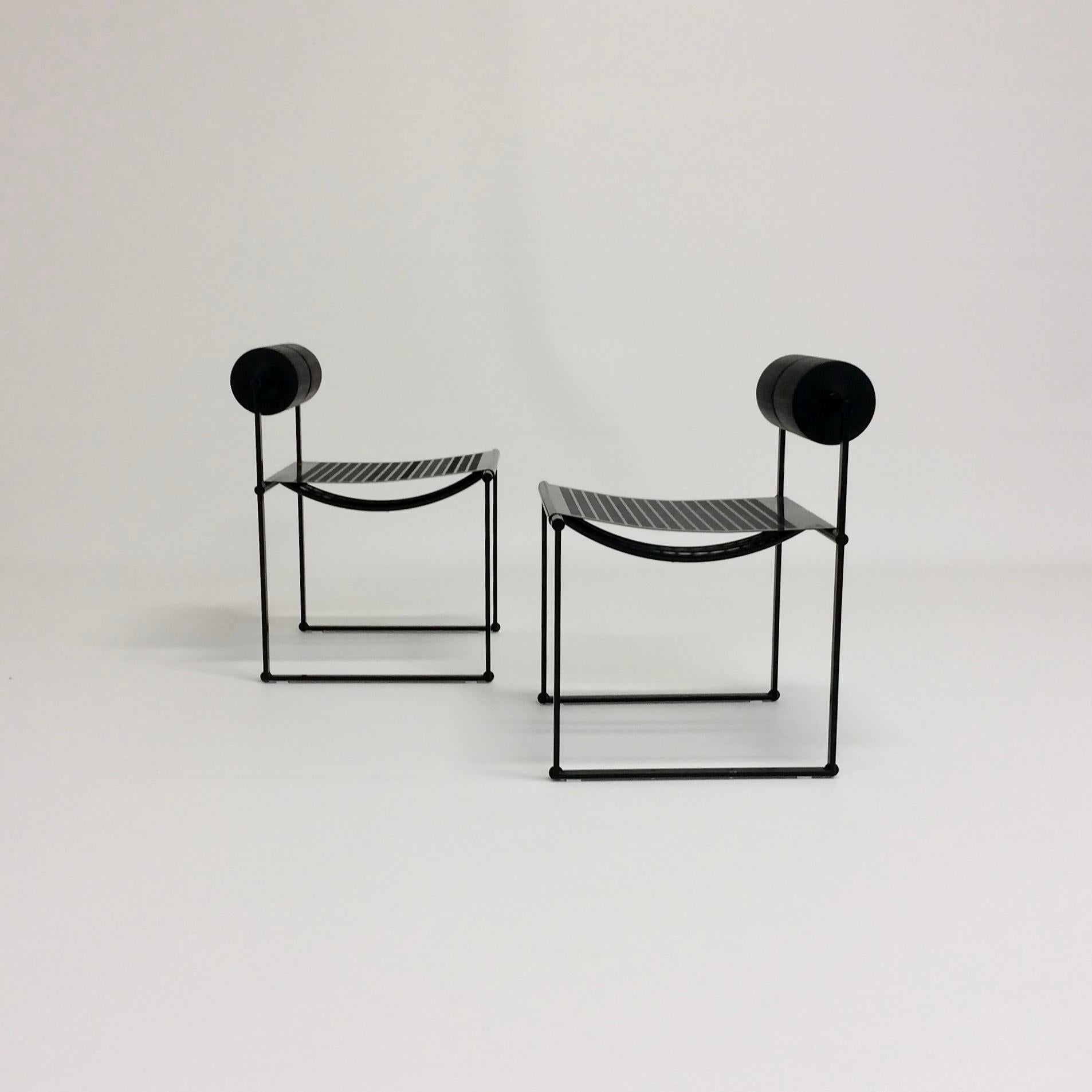 Nice pair of the iconic Mario Botta Prima chair, produced by Alias, 1982, Italy.
Black enameled steel, polyurethane foam cylinder.
Dimensions: 71 cm H, 51 cm D, 48 cm W, seat height: 43 cm.
Good original condition. 
This version out of