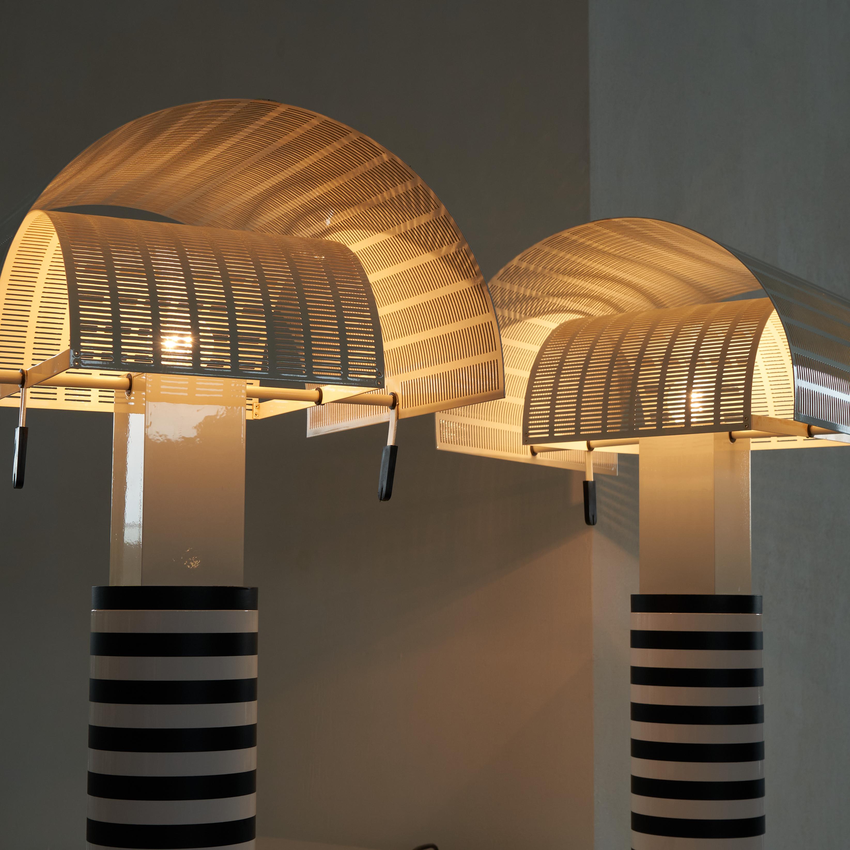 Exceptional pair of iconic vintage 'Shogun' Table Lamps by architect and designer Mario Botta (1943) for Artemide 1986.

Straight from the first owners, these table lamps have always been together. Bought by the original owners in 1987, these