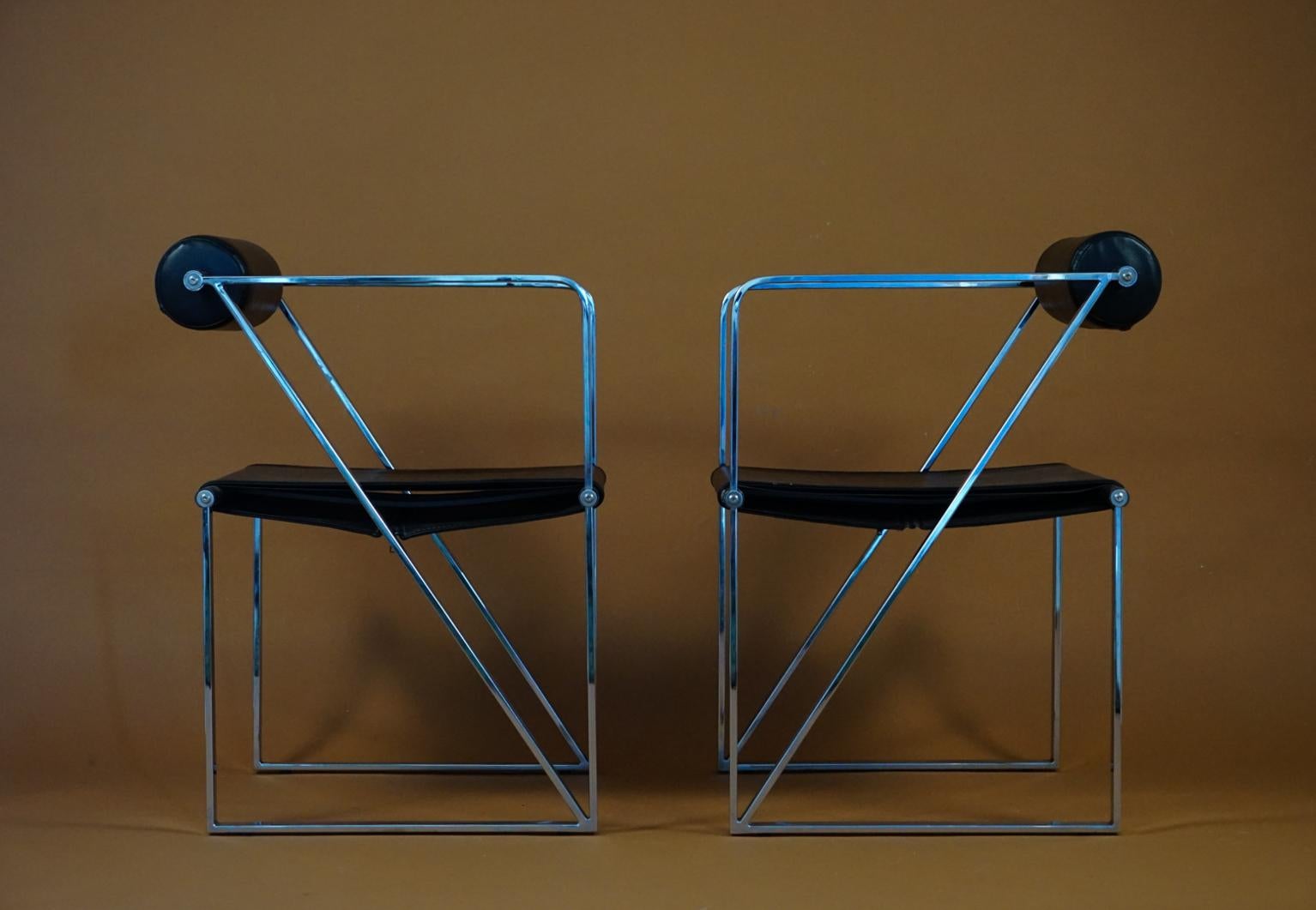Mario Botta Seconda Metal - Chrome armchairs Memphis for Alias Italy, 1982 edition with chrome and black leather is a rare version of the Iconic Seconda Mario Botta char. The Seconda armchair was designed by Mario Botta in 1982. Geometric shapes