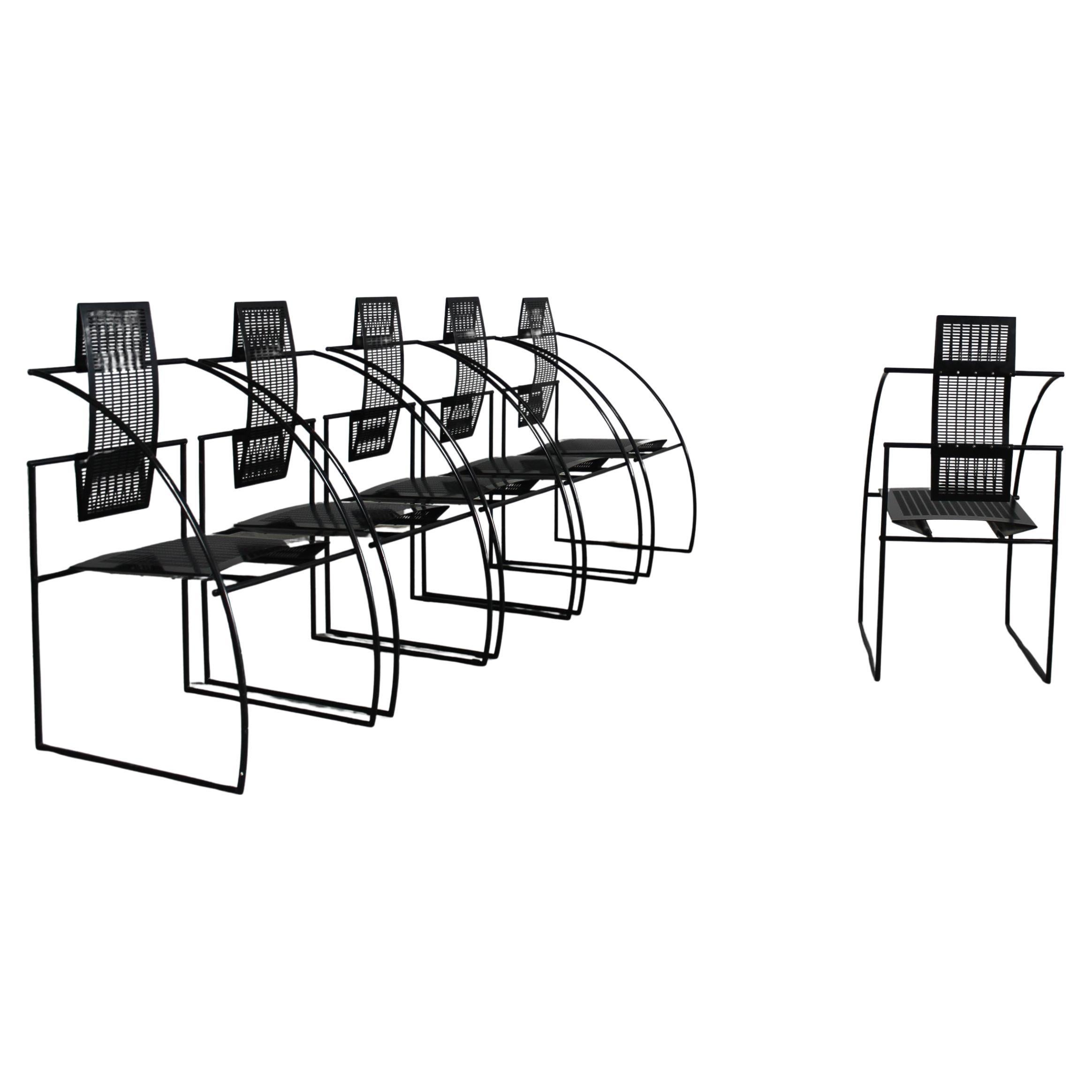 Set of six 605 Quinta chairs with a black steel rod frame seat and back in bent perforated sheet metal.
Designed by Mario Botta for Alias in 1985 (This chair is no longer in production).

The Quinta chair it's an architecture you can sit on, this