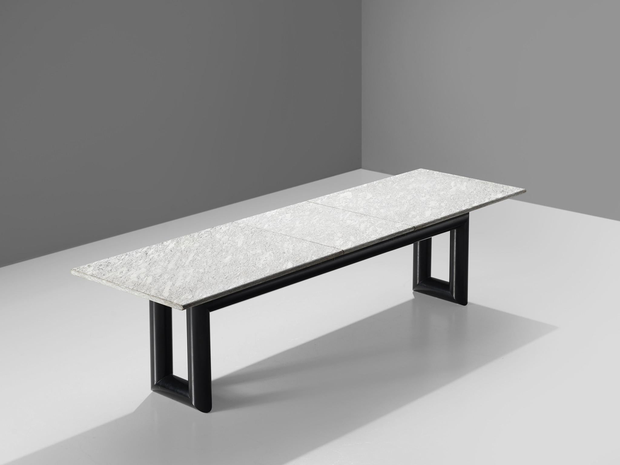 Mario Botta for Alias, conference table, metal and stone, Italy, 1983.

This sturdy table features two u shaped thick metal legs and a large, solid grey marble top. The metal base is painted black and forms a wonderful contrast with the long