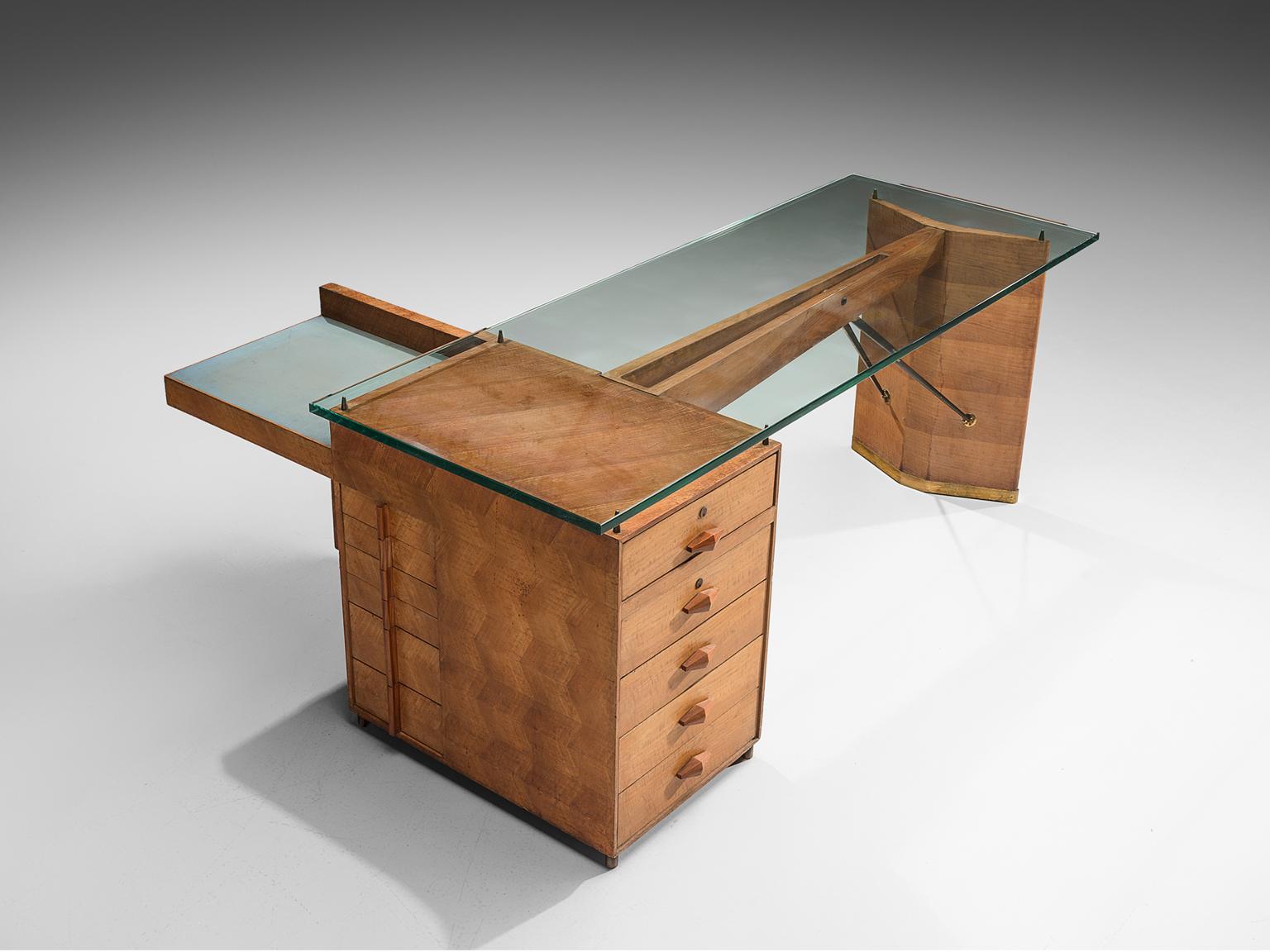 Mario Brunati, architectural desk with a wooden structure, thick glass top and brass details, Italy, circa 1940.

This exquisite geometric Rationalist desk is designed by Mario Brunati. There are many features within this desk that tell a story