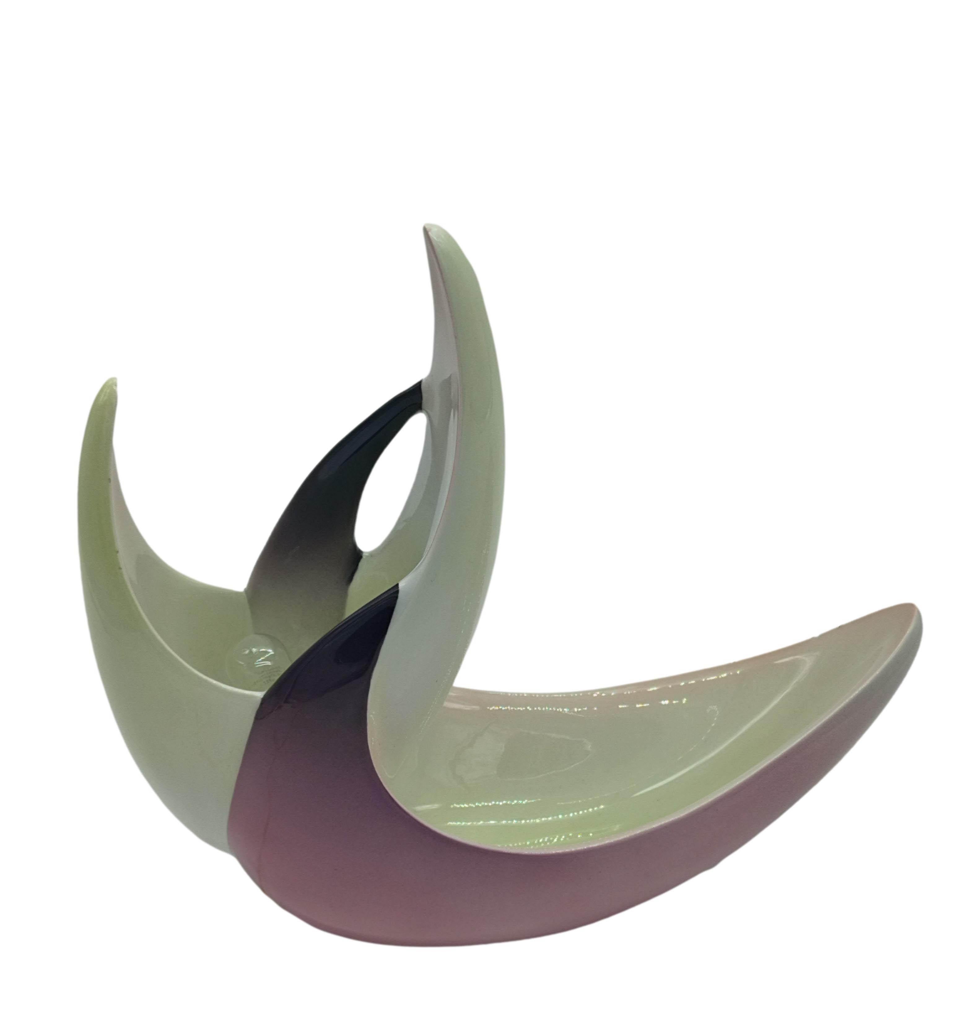 A beautiful and exclusive handcrafted ceramic lamp made by Ariele Torino in the 1970s based on a design by Mario Brunetti.
This lamp is made from a single piece of whimsically shaped ceramic. The switch and plug are also original from the 1970s.