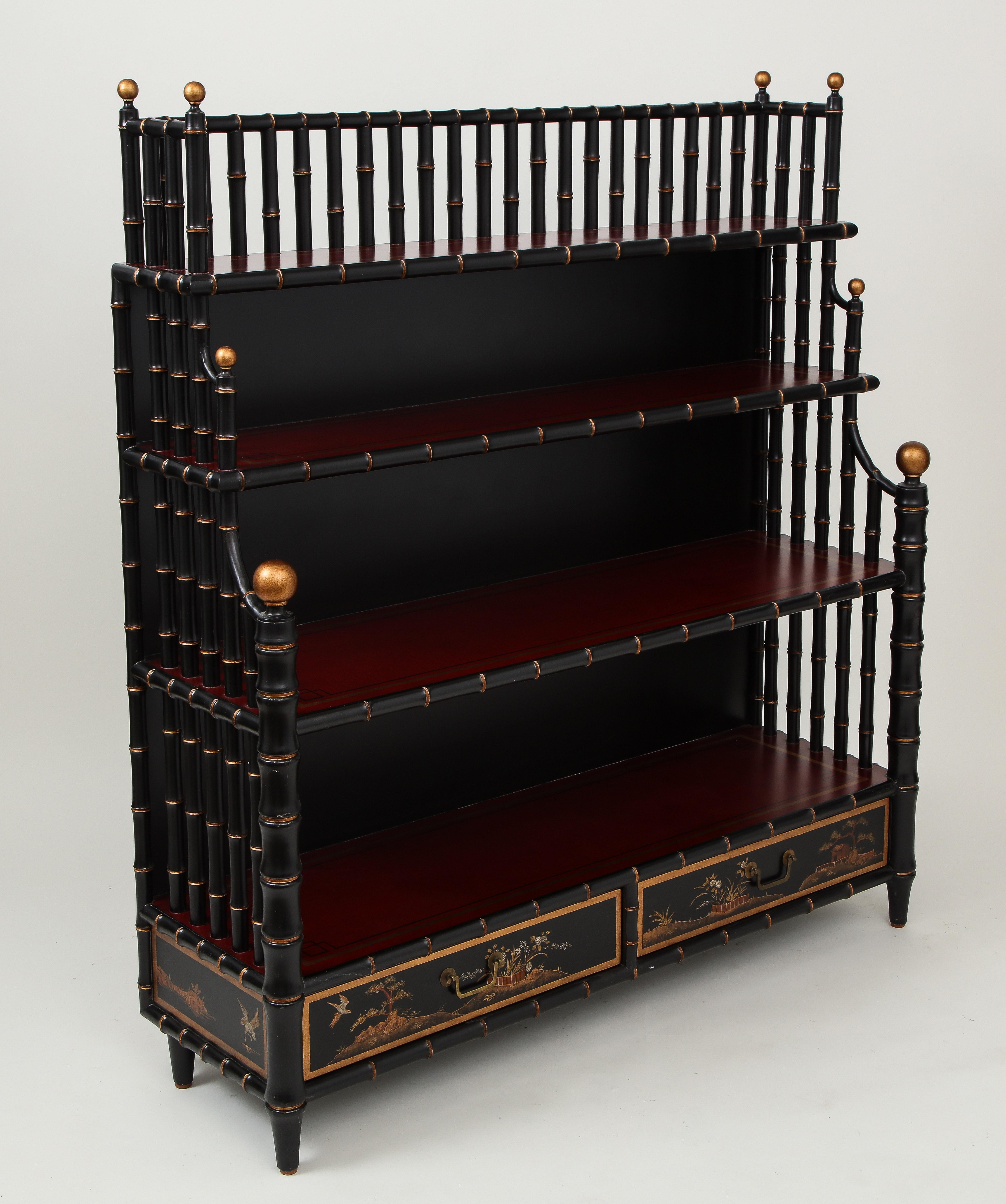 Designed by Mario Buatta for Widdicomb after a Regency bookcase in his own collection; black with gilt faux bamboo detailing; the four shelves over two short drawers with chinoiserie decoration.