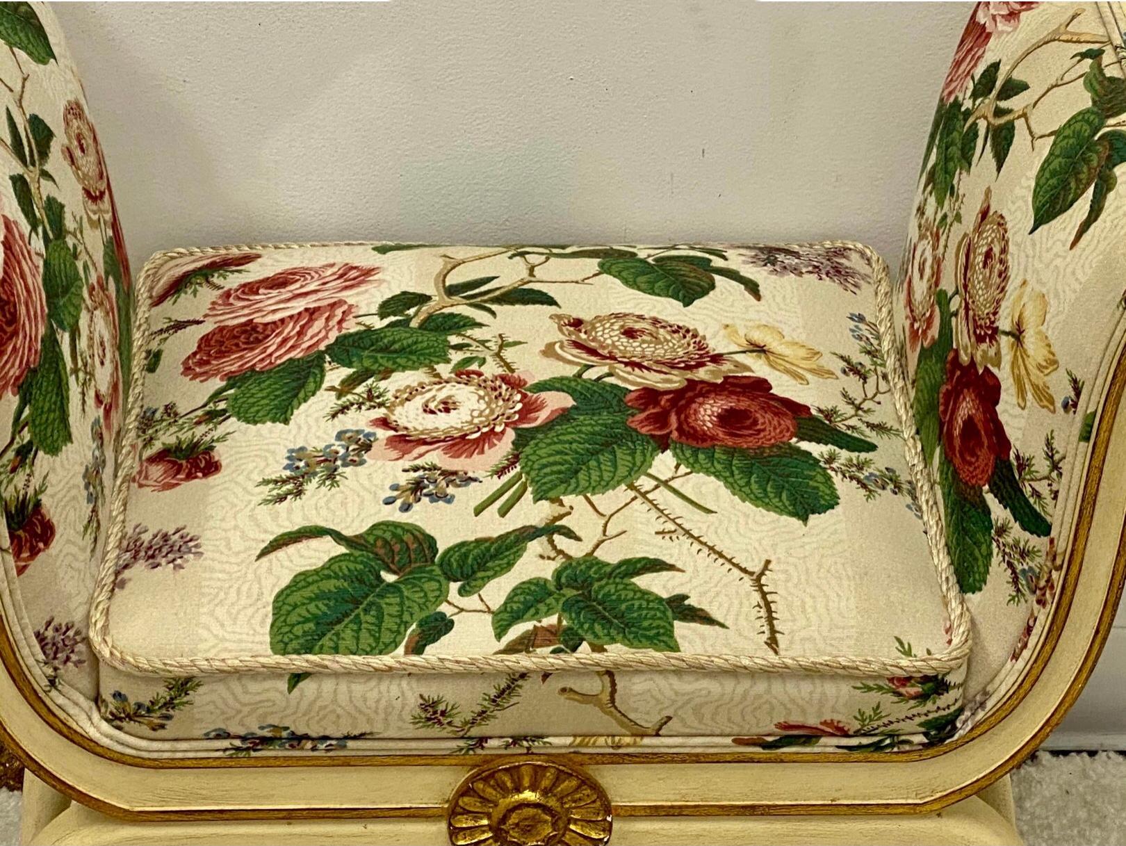 This pair of Mario Buatta style benches in floral chintz fabric have Classic Regency frames. They were created by Schumacher and are in excellent condition. Measure: Seat 16.5”.