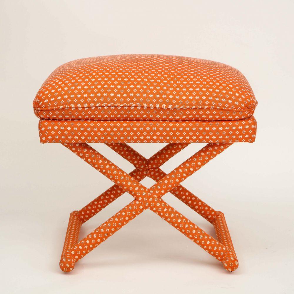 Made by DeAngelis for Mario Buatta; with rectangular fixed cushion over the X-form frame, all upholstered in a salmon pink and woven cotton. Bearing DeAngelis label to underside.

Collection of Mario Buatta, New York, NY