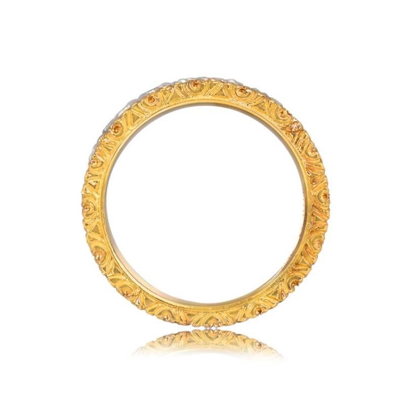 An exquisite Mario Buccellati Ramage Wedding Band, adorned with intricate hand-engravings and an openwork foliate pattern. Two-tone 18k gold with a floral motif and lively diamonds on the inner section. The total weight of the diamonds is